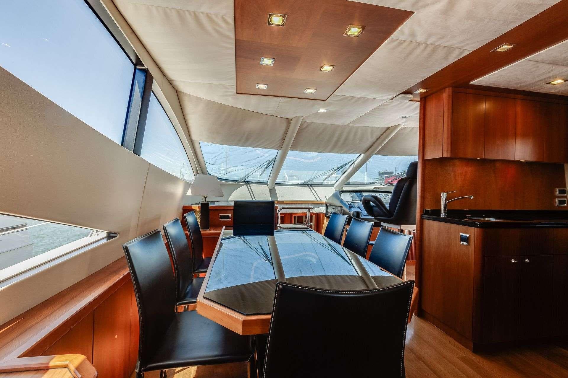 Luxurious interior of 2009 Sunseeker Manhattan 70 yacht with elegant dining area.