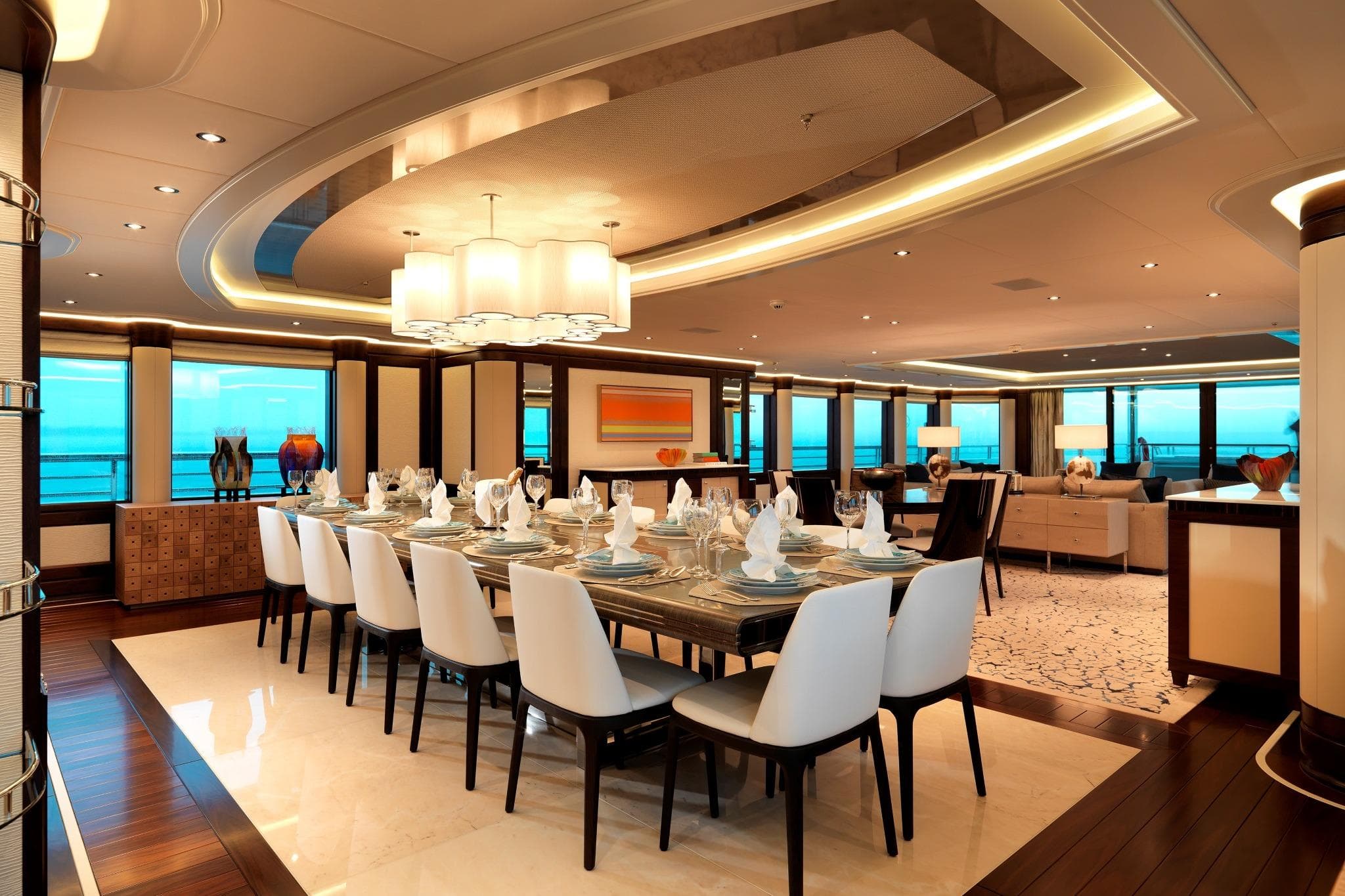 Luxurious dining area on 2016 Hakvoort Custom yacht, featuring elegant table settings and modern decor.