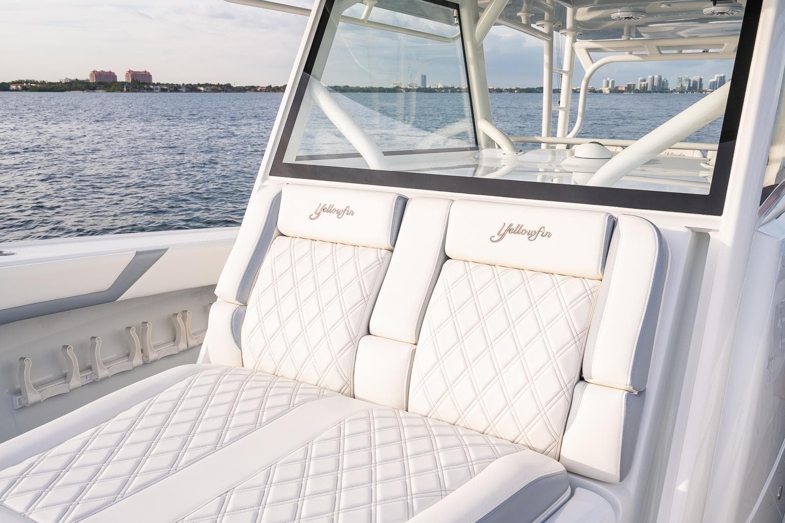 2022 Yellowfin 42 boat with luxurious white seating on a calm water backdrop.