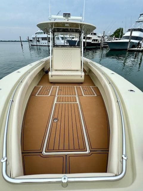 2010 Contender 39 Tournament boat with spacious deck, docked in marina.