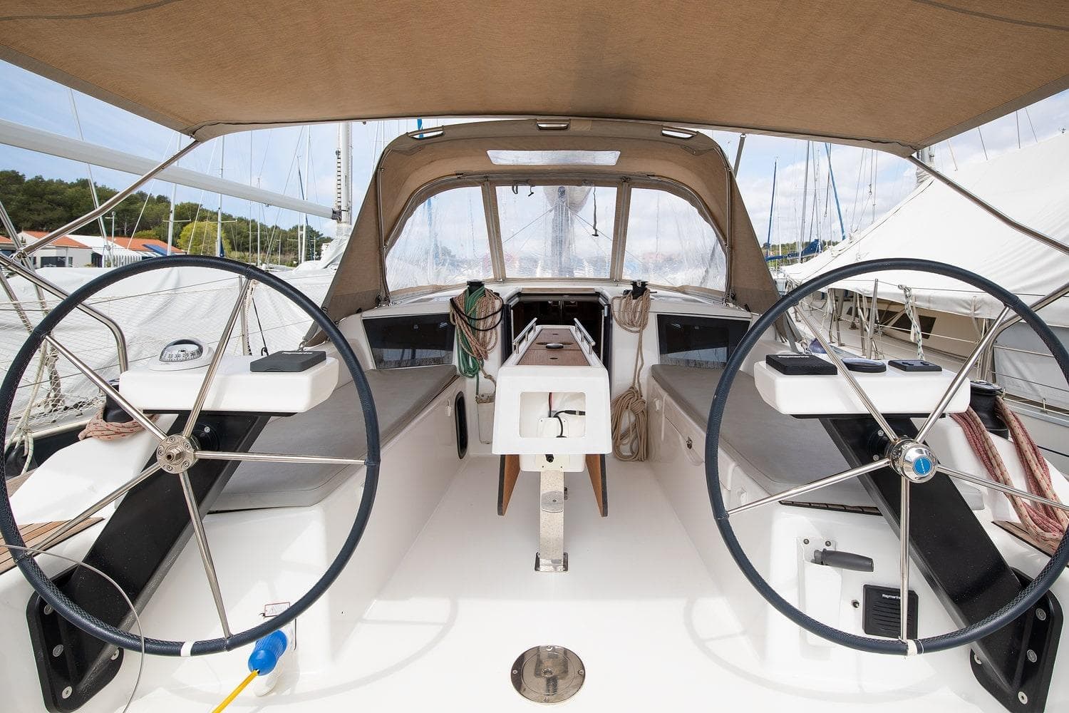 Cockpit of 2019 Dufour 360 Grand Large sailboat with dual steering wheels.