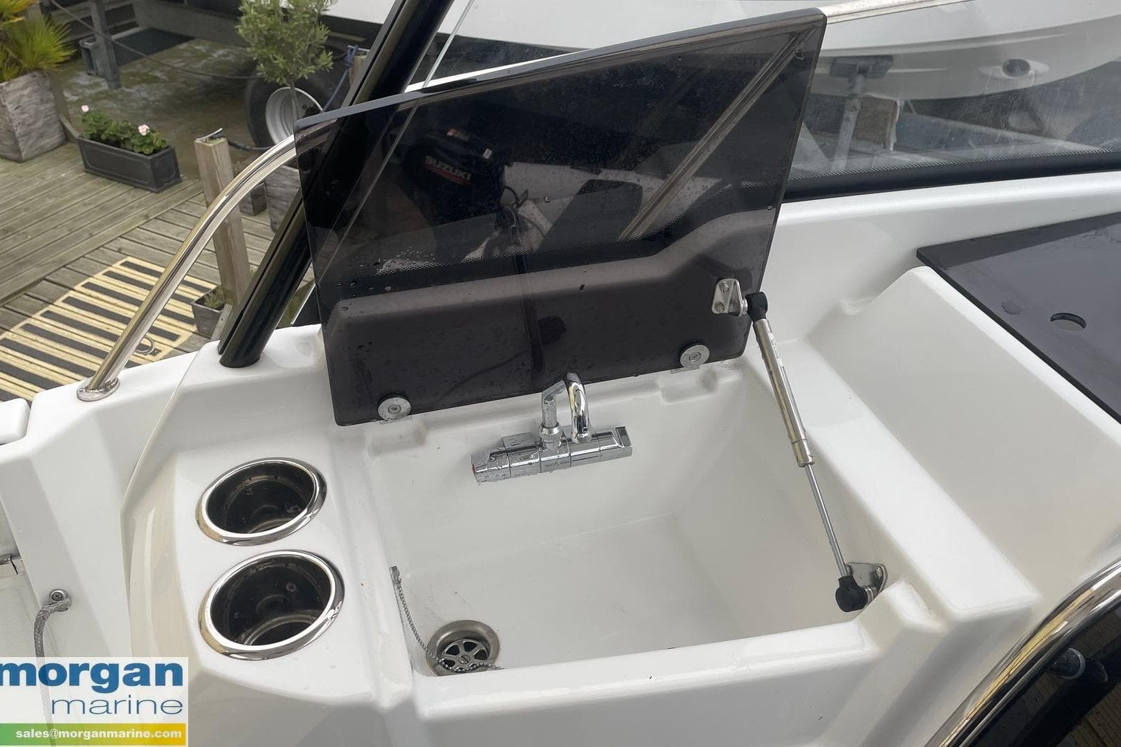 2024 Jeanneau Cap Camarat 9.0 WA Serie 2 boat sink with cup holders and cover.