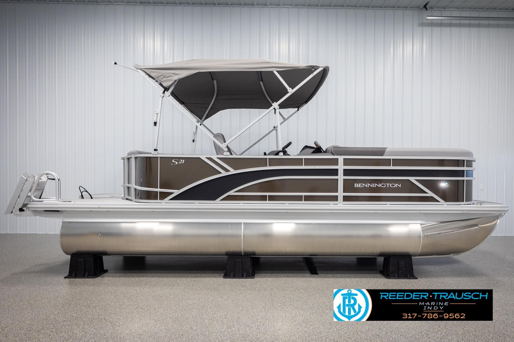 2025 Bennington 21 SL pontoon boat in showroom.
