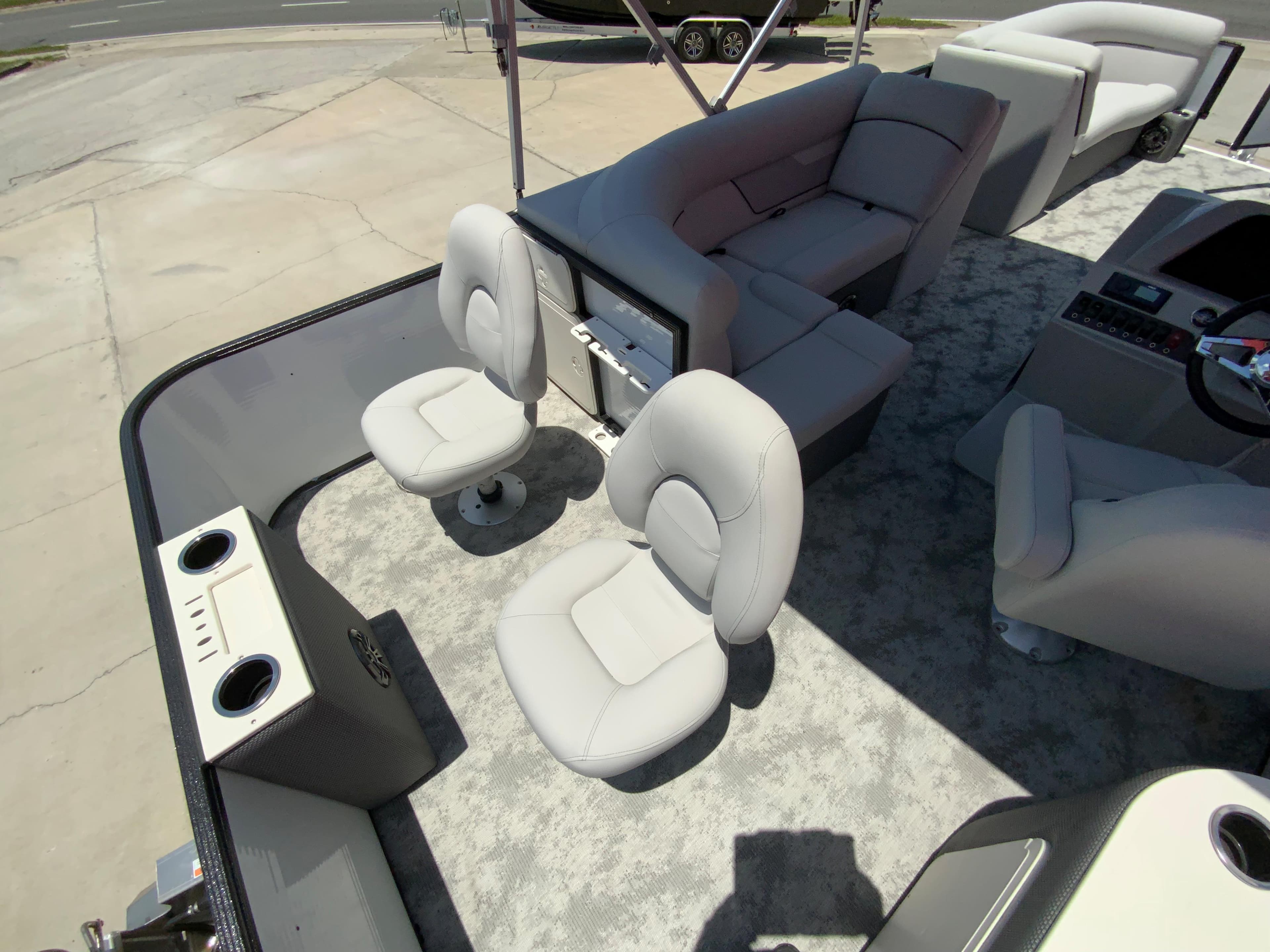 2023 Crest Classic LX 220 SF boat interior with seating and cup holders.
