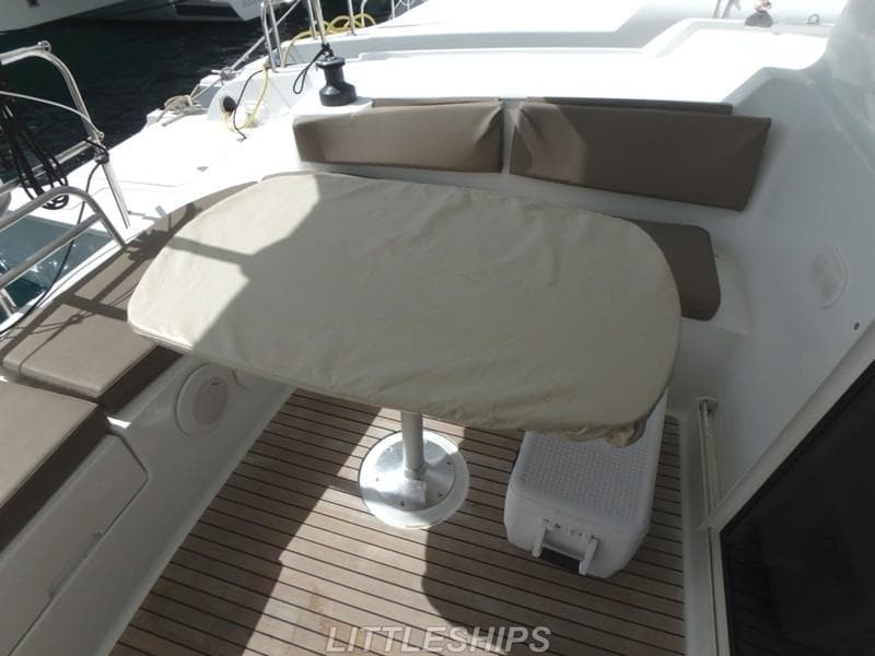 2015 Fountaine Pajot MAHE EVO yacht deck with table and seating.