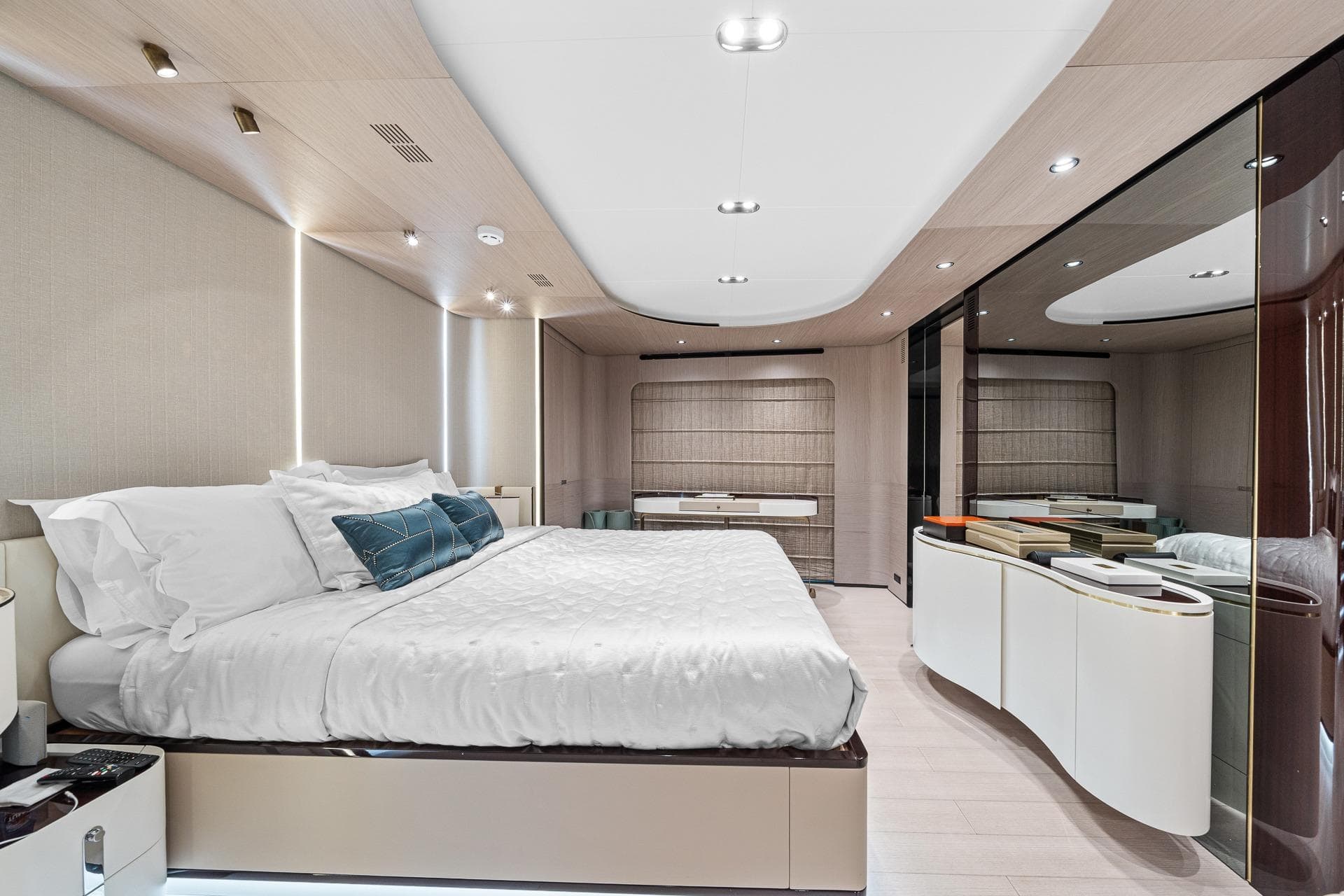 Luxurious bedroom interior of 2022 Azimut Grande 27 METRI yacht, featuring modern design and elegant furnishings.