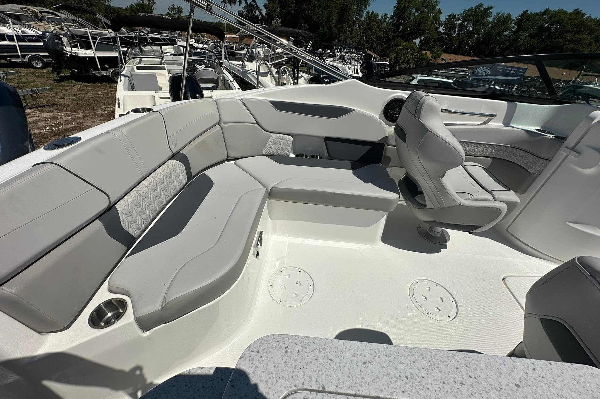 2026 Hurricane SunDeck 2400 OB boat interior with spacious seating and modern design.