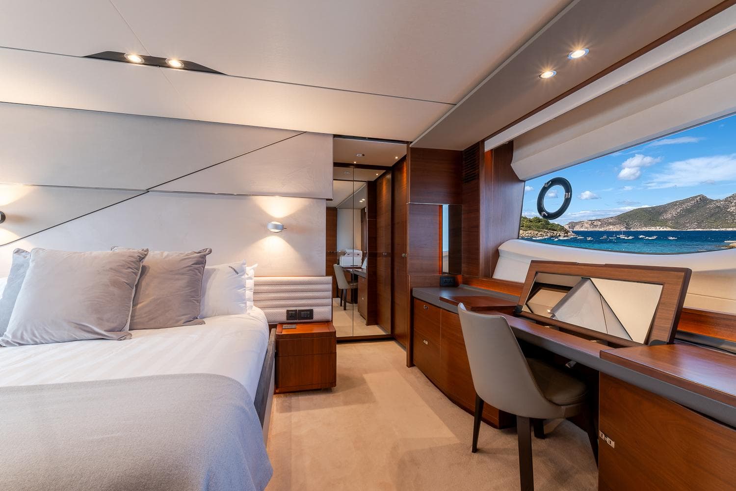 Luxurious 2019 Princess S78 yacht bedroom with ocean view and elegant interior design.