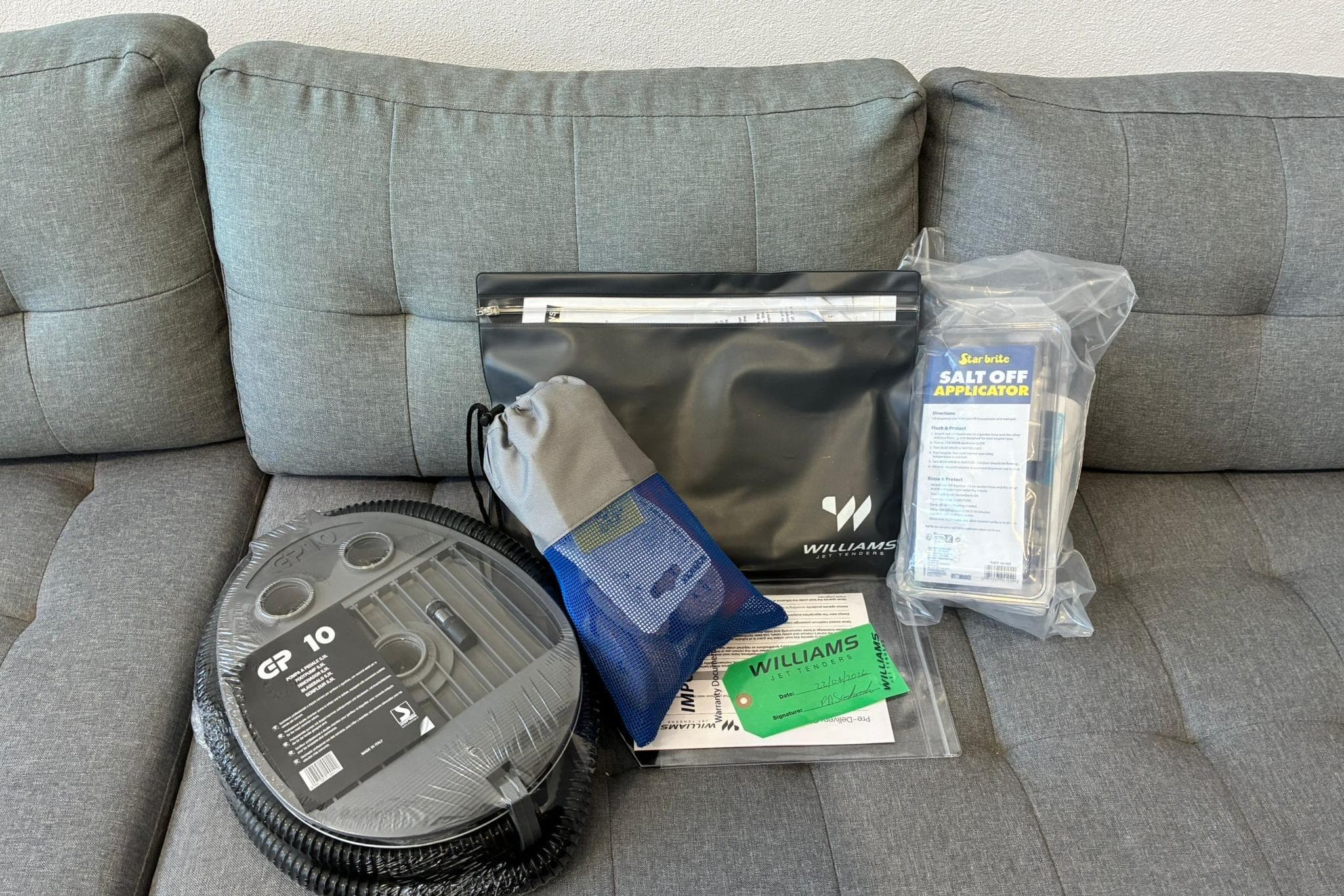 2026 Williams Jet Tenders Sportjet 435 accessories on a gray sofa.