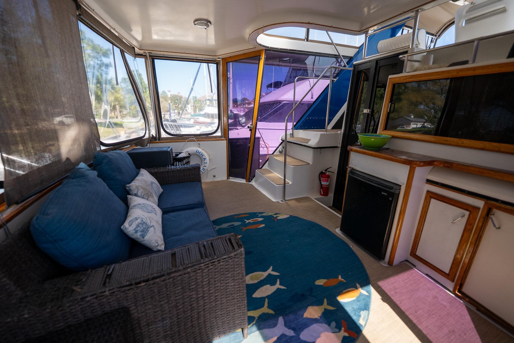 Interior of 1988 Carver 42 Aft Cabin Motoryacht with cozy seating and nautical decor.