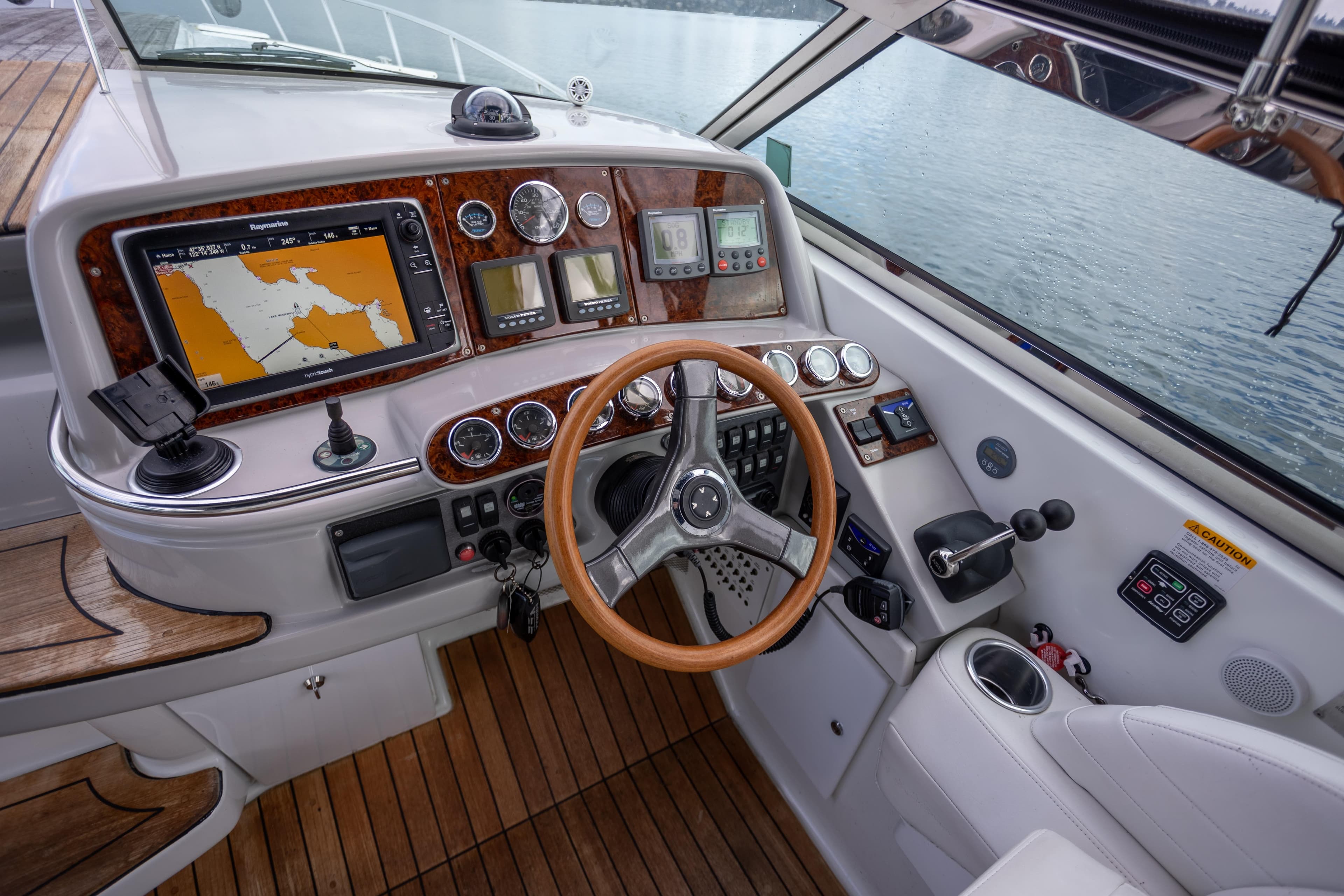 2005 Formula 400 Super Sport boat cockpit with navigation system and wooden steering wheel.