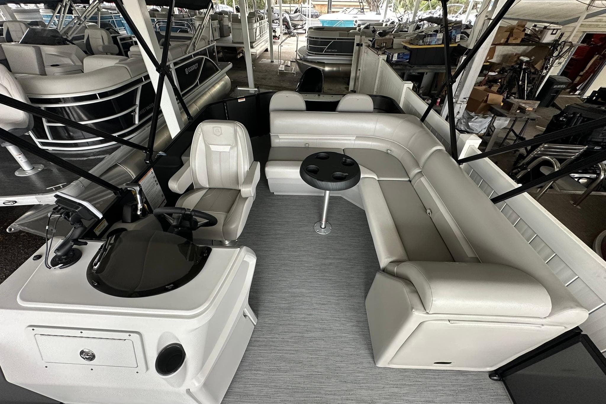 2026 Sweetwater 2286FX pontoon boat interior with seating and helm station.