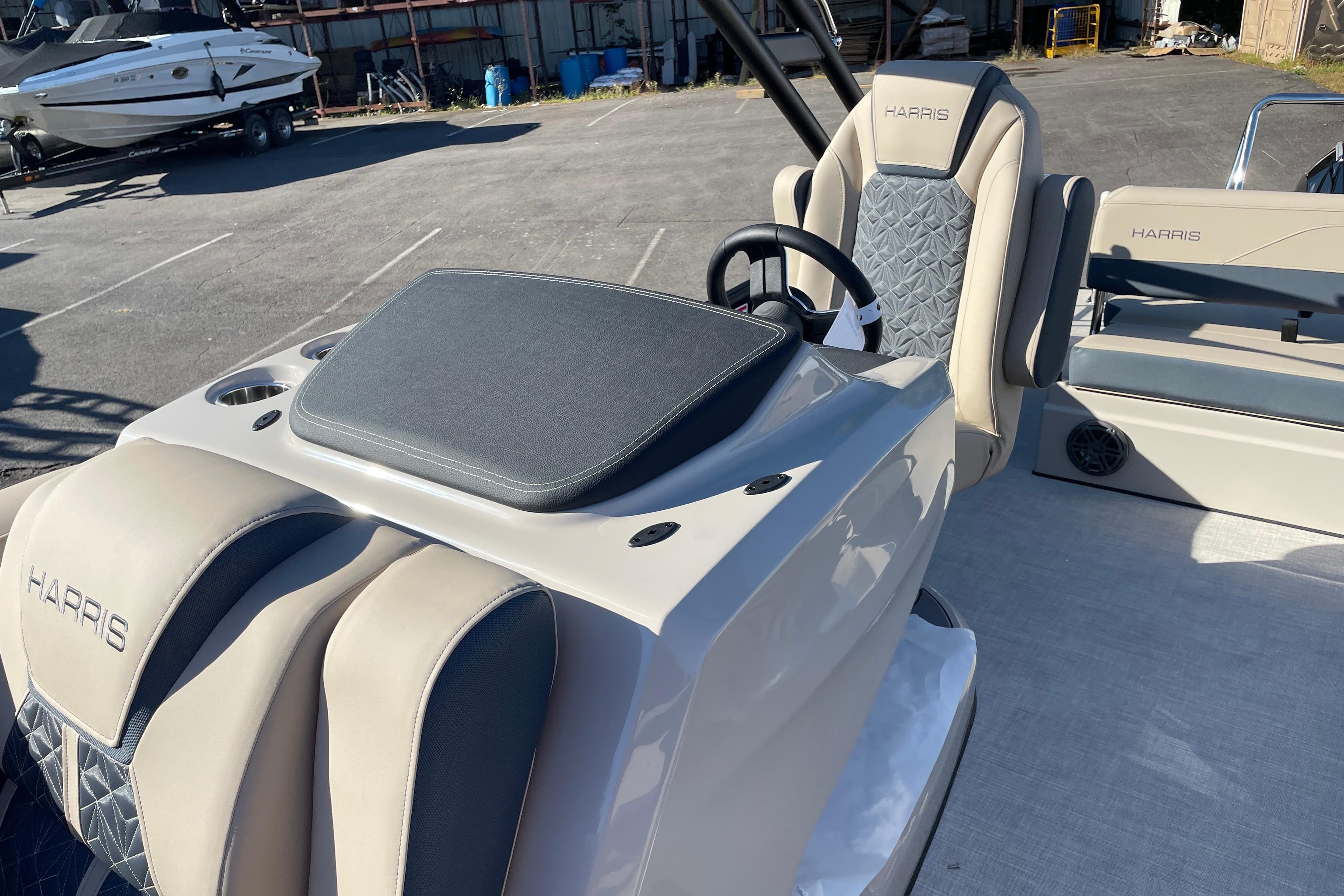 2026 Harris Grand Mariner 230 SL boat interior with luxury seating and steering console.