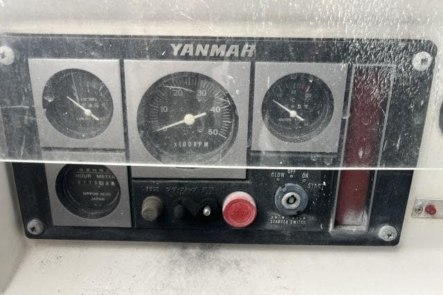 Control panel of a 2004 J Boats J/133 with Yanmar engine gauges.