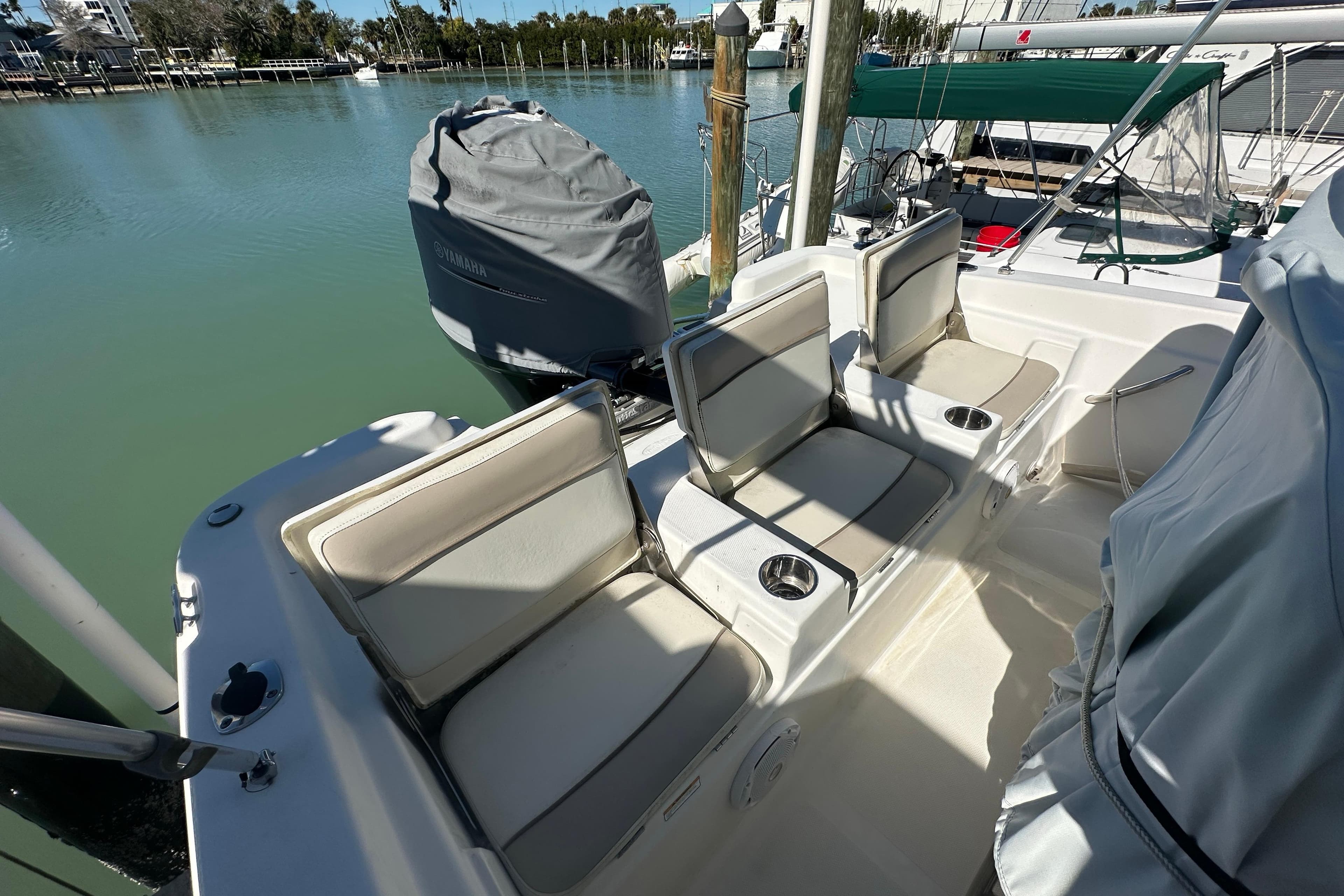 2017 NauticStar 211 Angler boat interior with cushioned seating and cup holders.