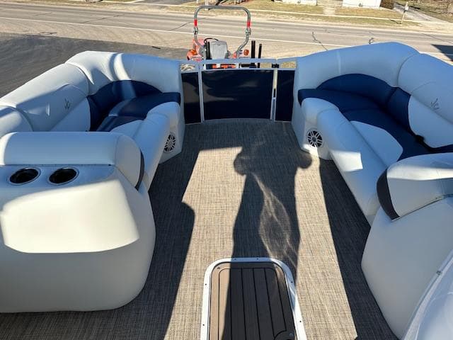2024 JC Spirit 221 TT Sport pontoon boat interior with plush seating and cup holders.