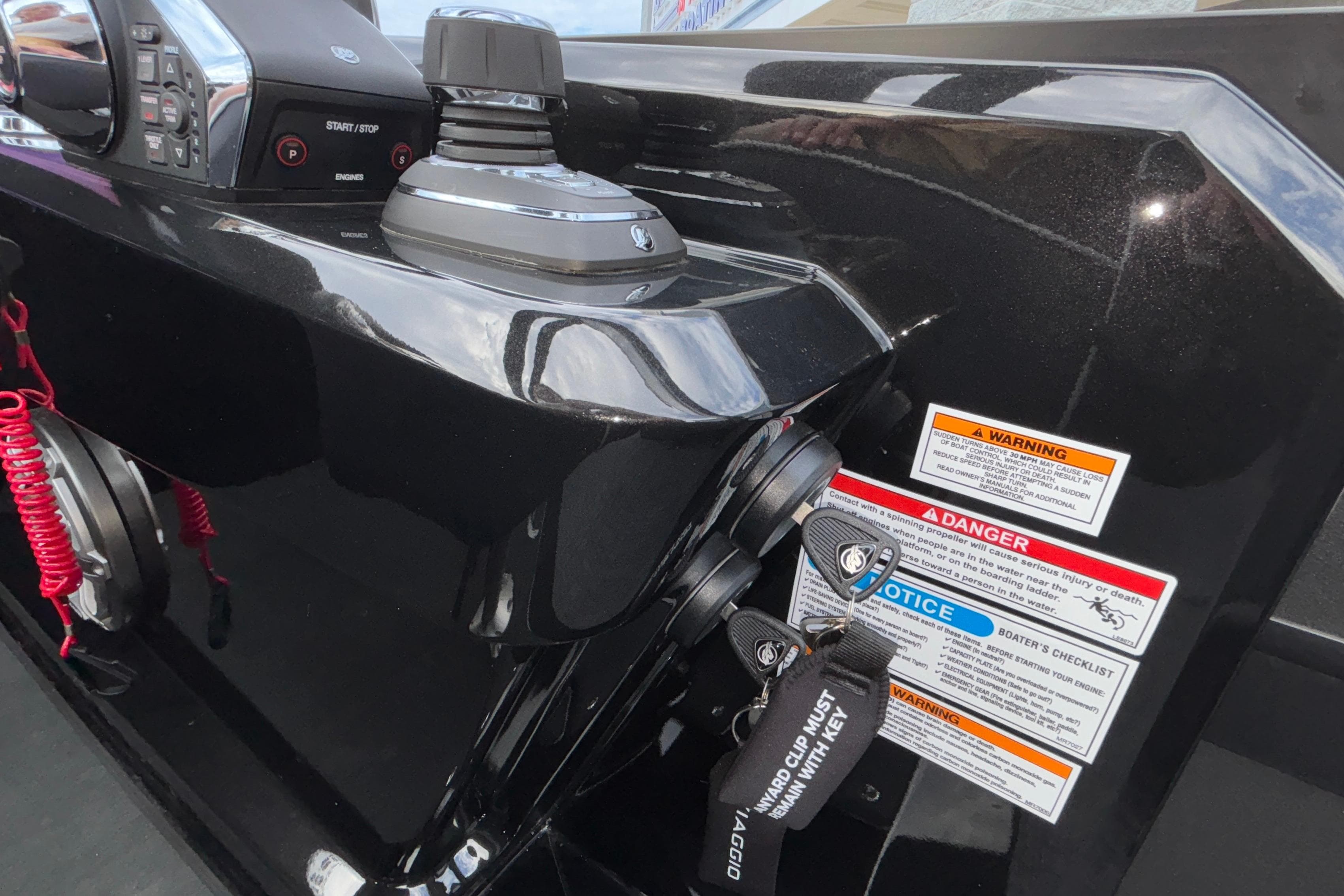 Control panel of 2026 Viaggio D28UW A-T boat with safety warnings and key tether.