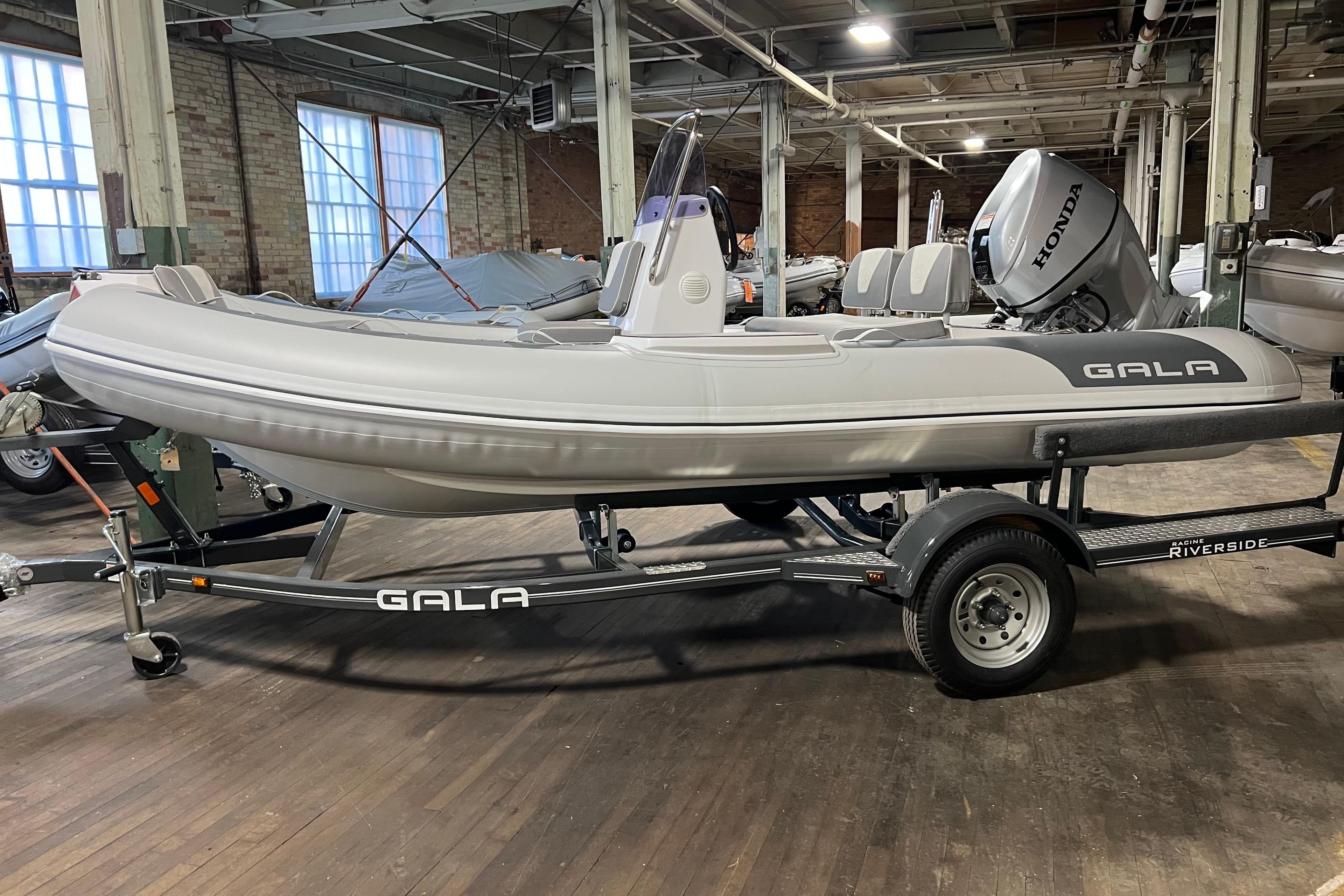 2026 Gala V420 inflatable boat on trailer in industrial setting.