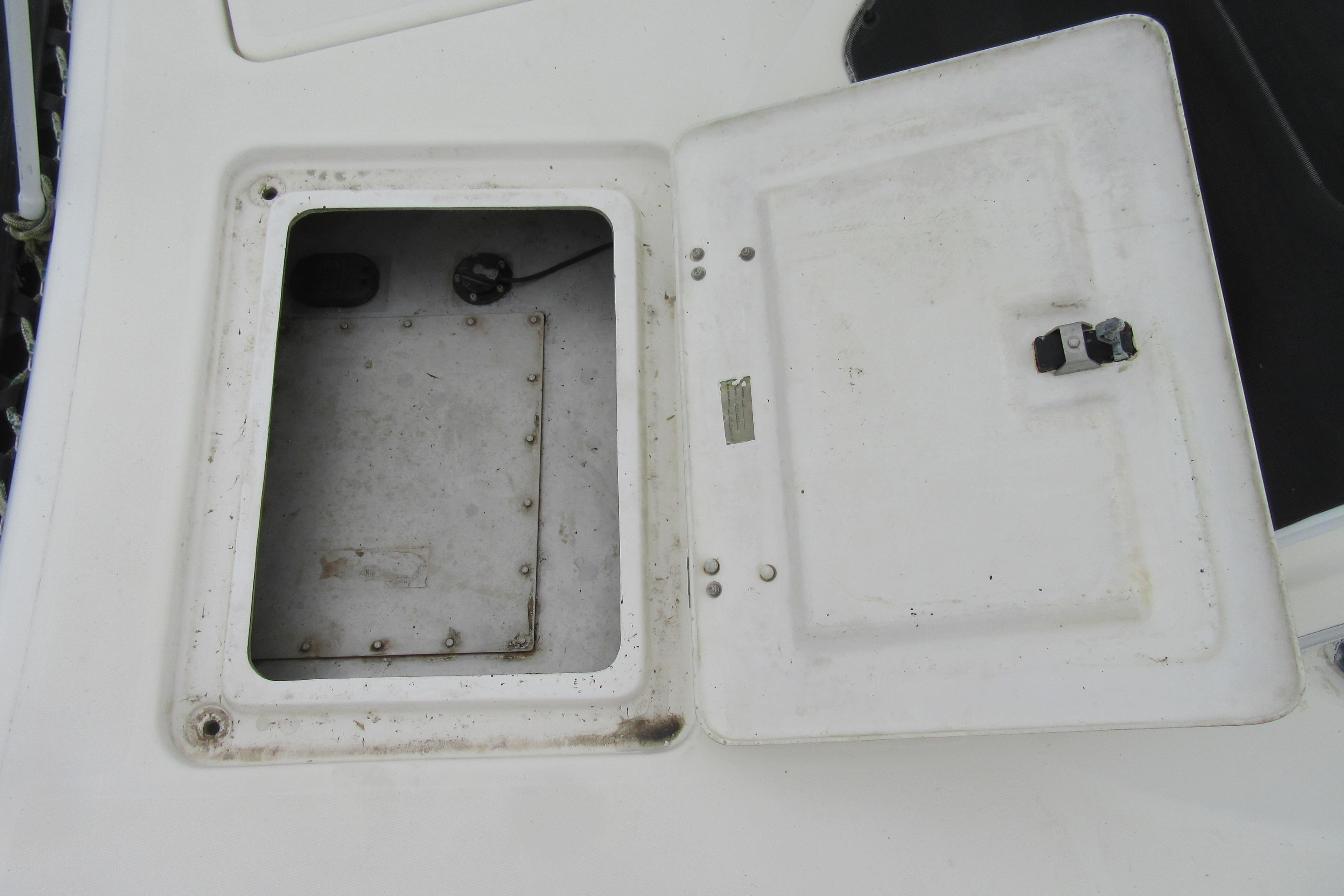 Open hatch on 2001 Catana 471 catamaran deck, showing interior compartment.