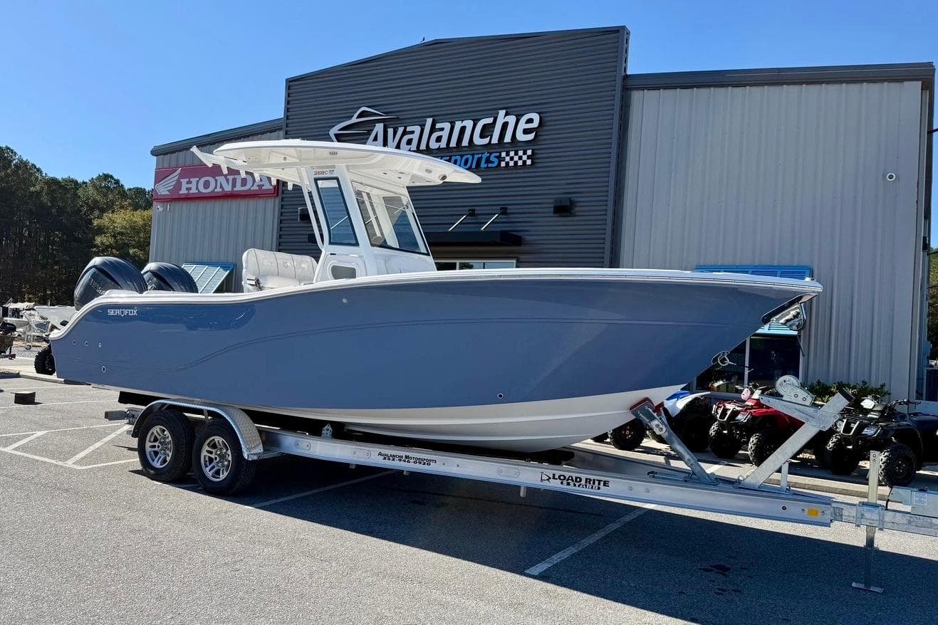 2026 Sea Fox 268 Commander boat on trailer at dealership.