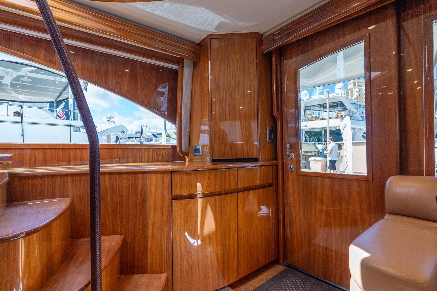 Luxurious interior of 2017 Viking 62 Enclosed Bridge yacht with polished wood finish.