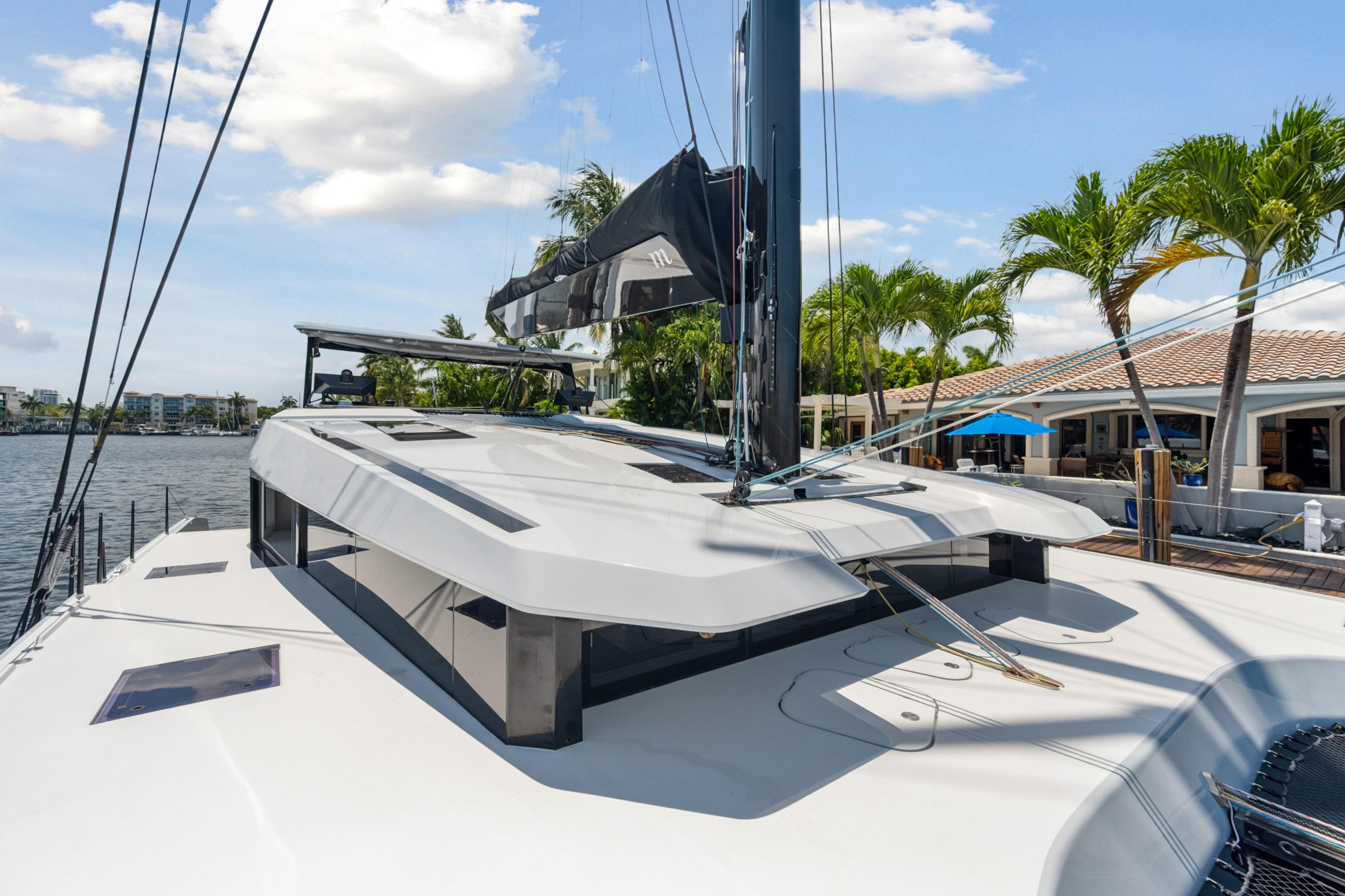 2019 McConaghy MC60 yacht docked, showcasing sleek design and modern architecture.