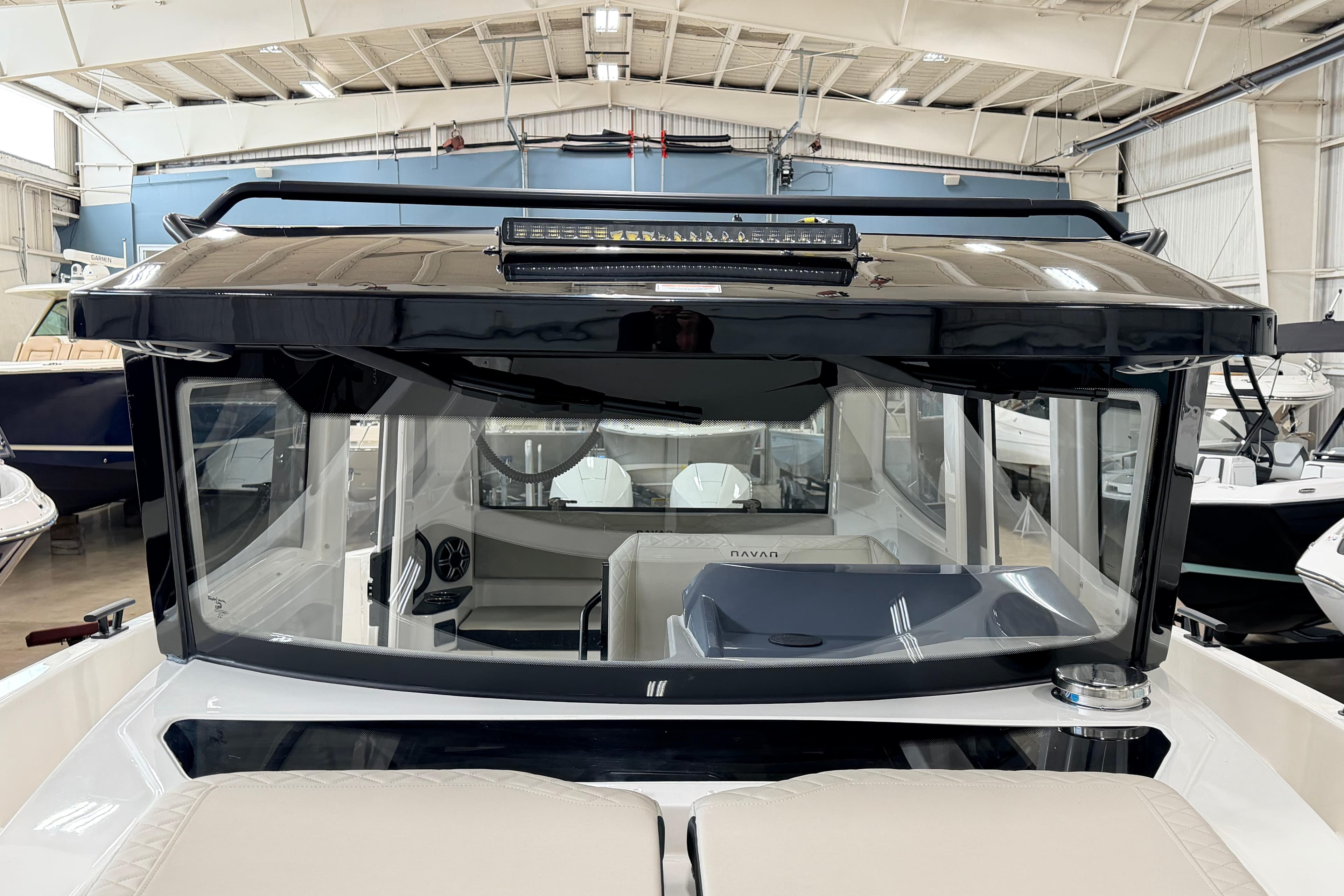 2026 Navan C30 boat interior in a showroom, showcasing modern design and features.