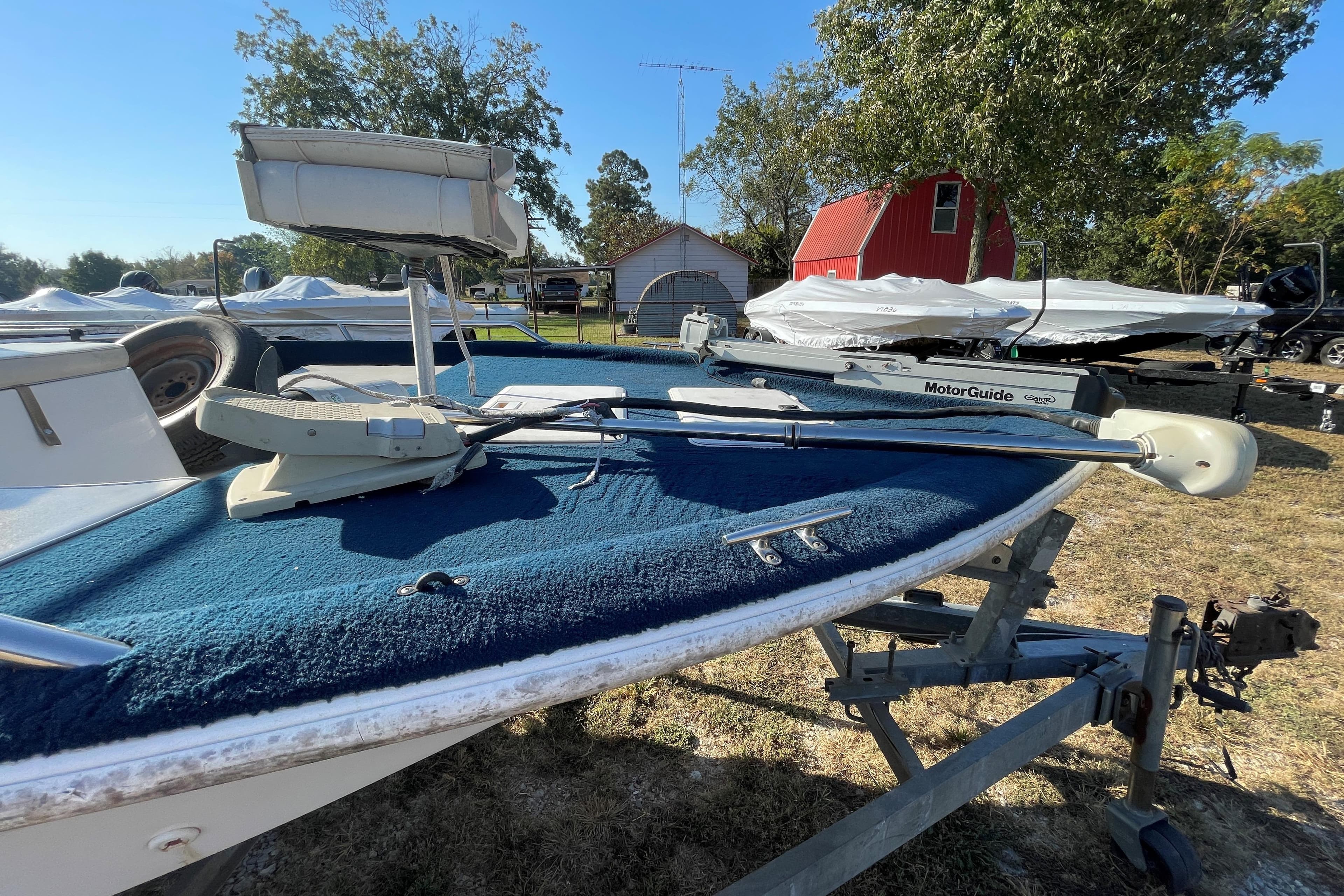 1997 Ebbtide 190 SV boat with MotorGuide trolling motor on trailer.