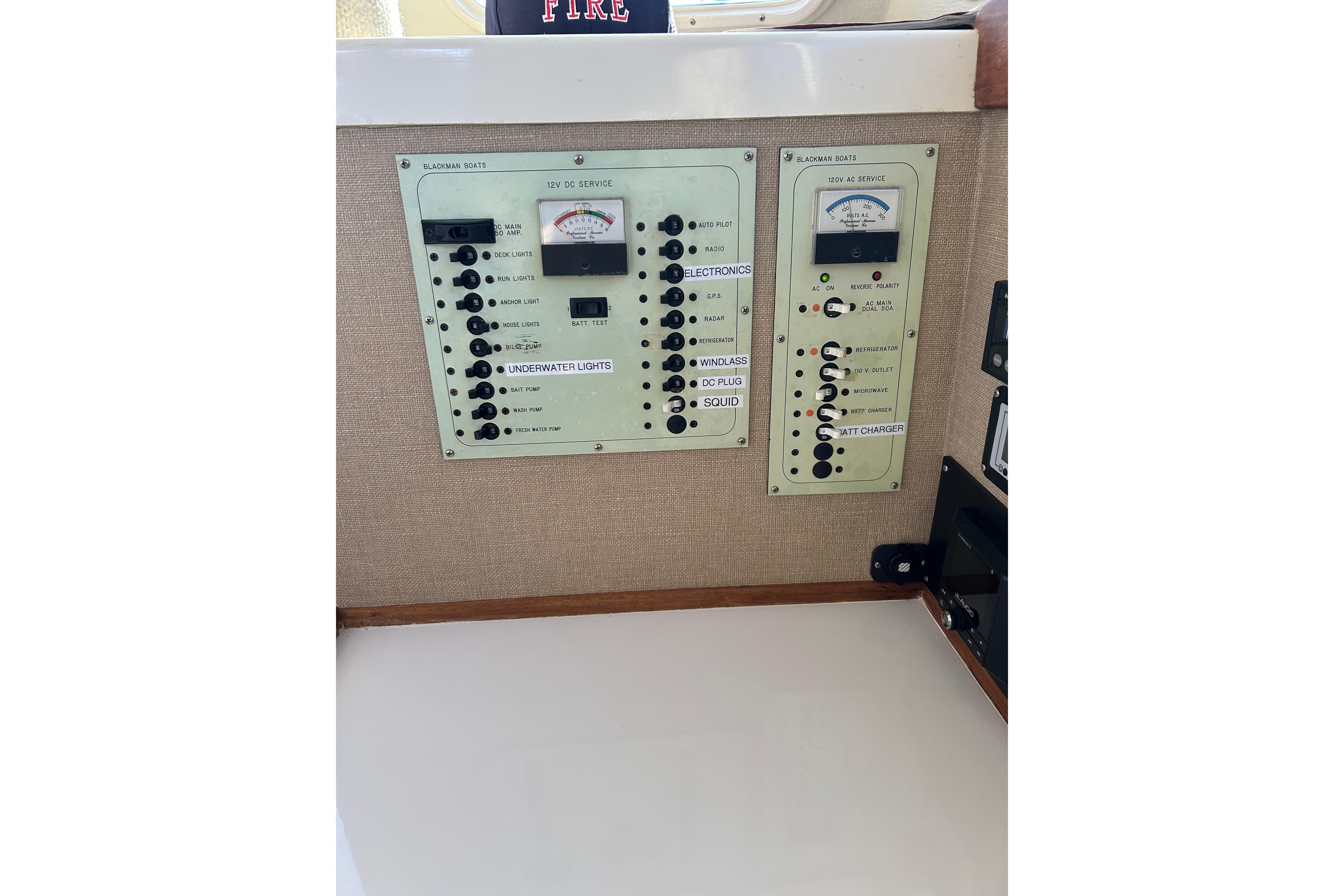 Control panel of a 1998 Blackman Billfisher 26 boat, featuring various switches and gauges.