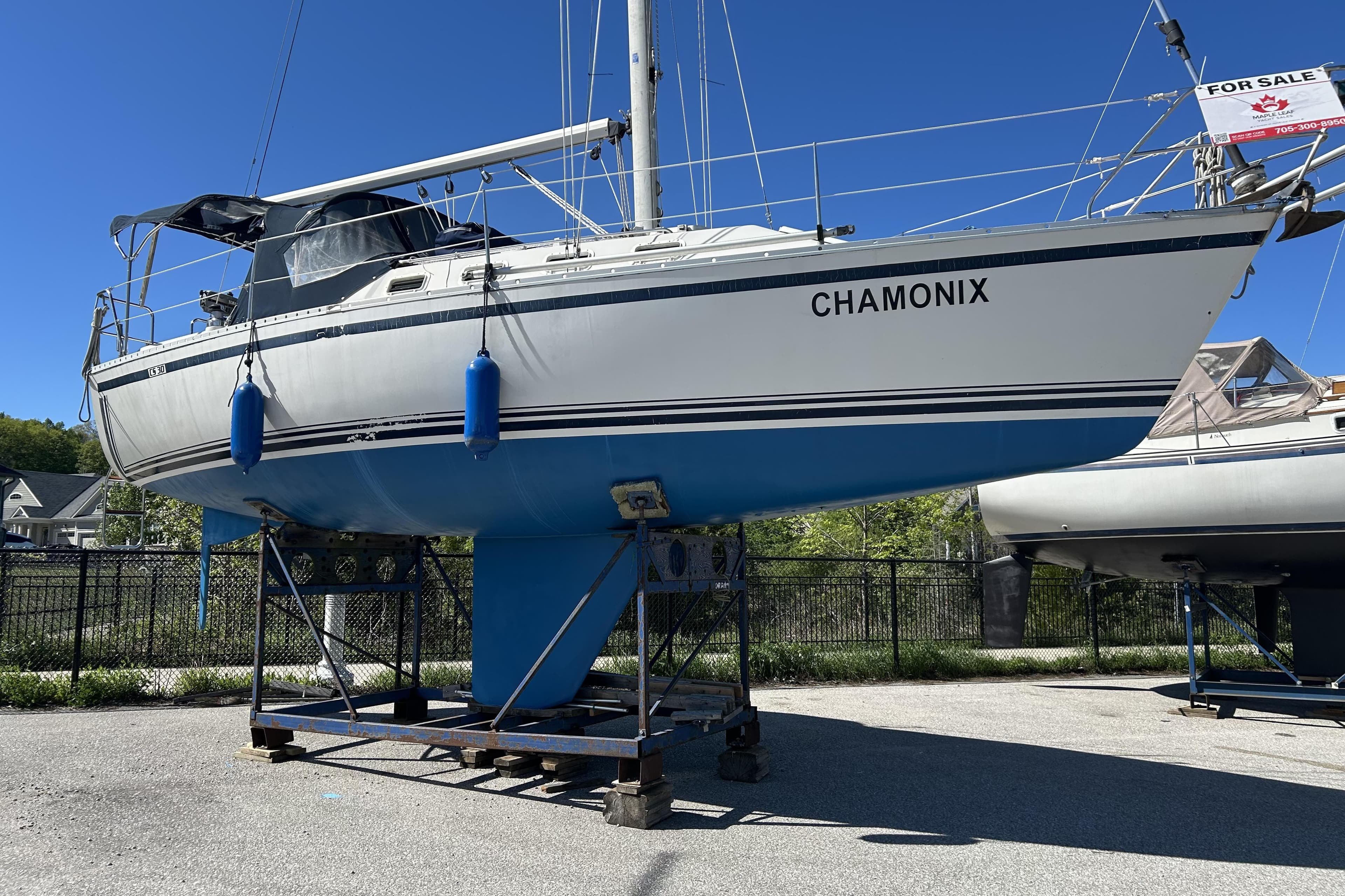 Sailboat "Chamonix" for sale, 1985 CS 30 model, displayed on a stand.