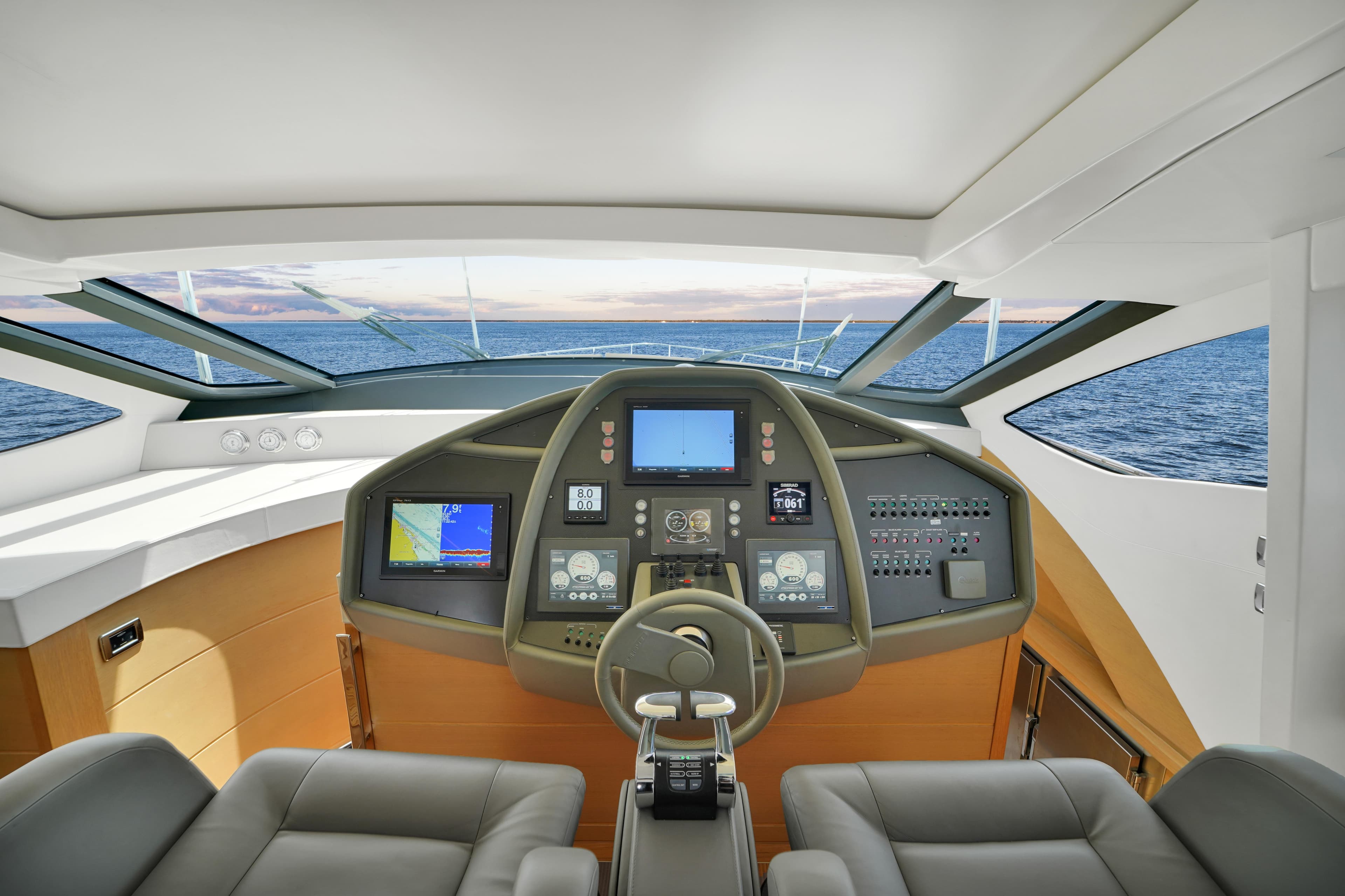 Cockpit of 2009 Pershing 72 yacht with modern navigation equipment and ocean view.