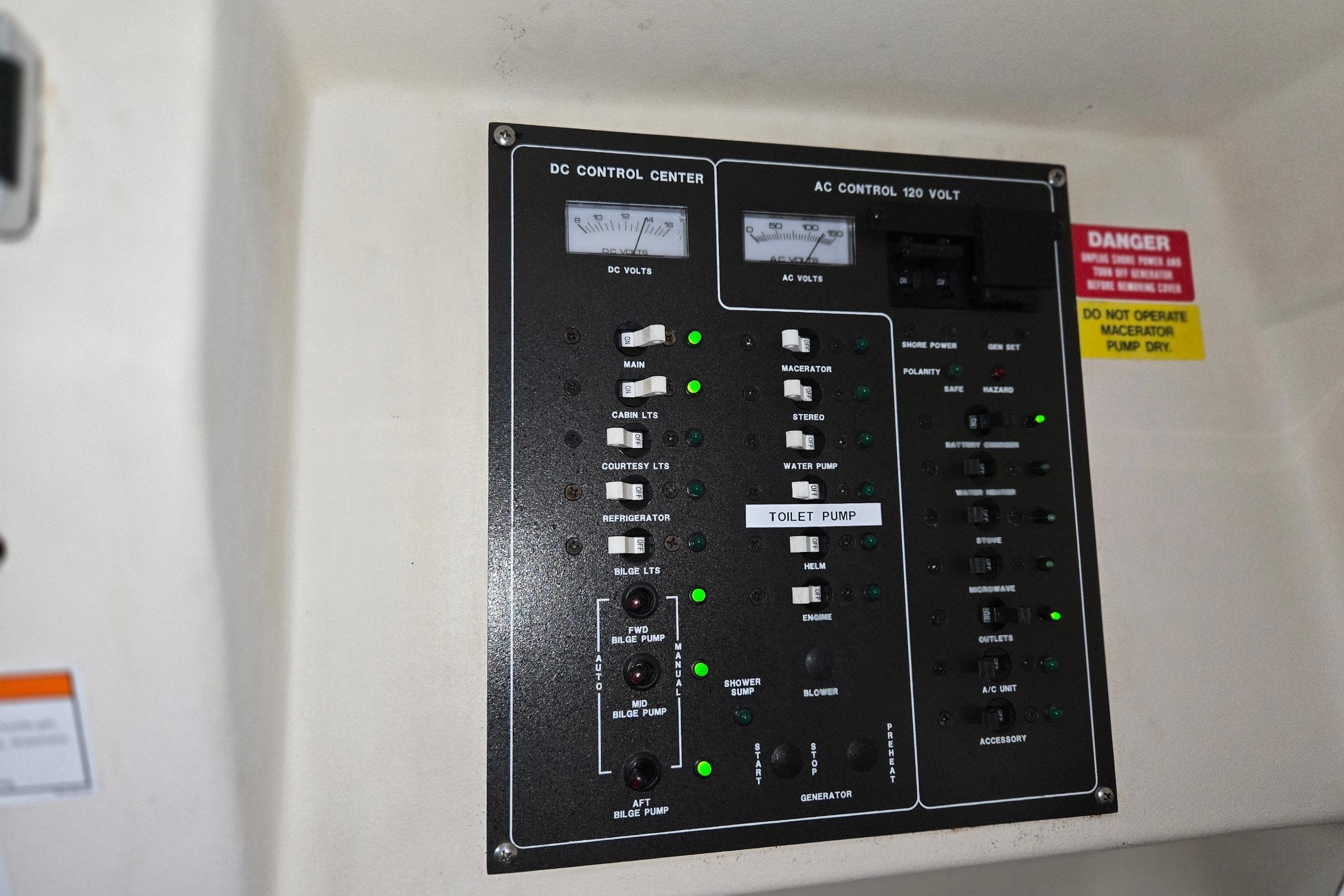 Control panel of a 1998 Mainship Pilot 30 boat, featuring DC and AC systems.