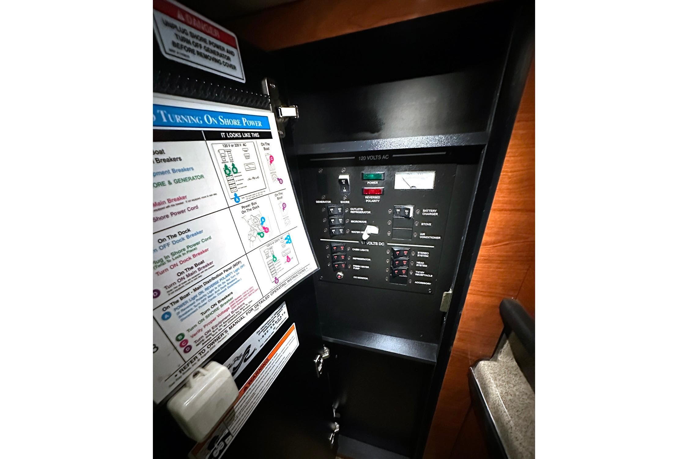 Electrical panel inside 2007 Sea Ray Sundancer 260 boat, featuring power controls and instructions.