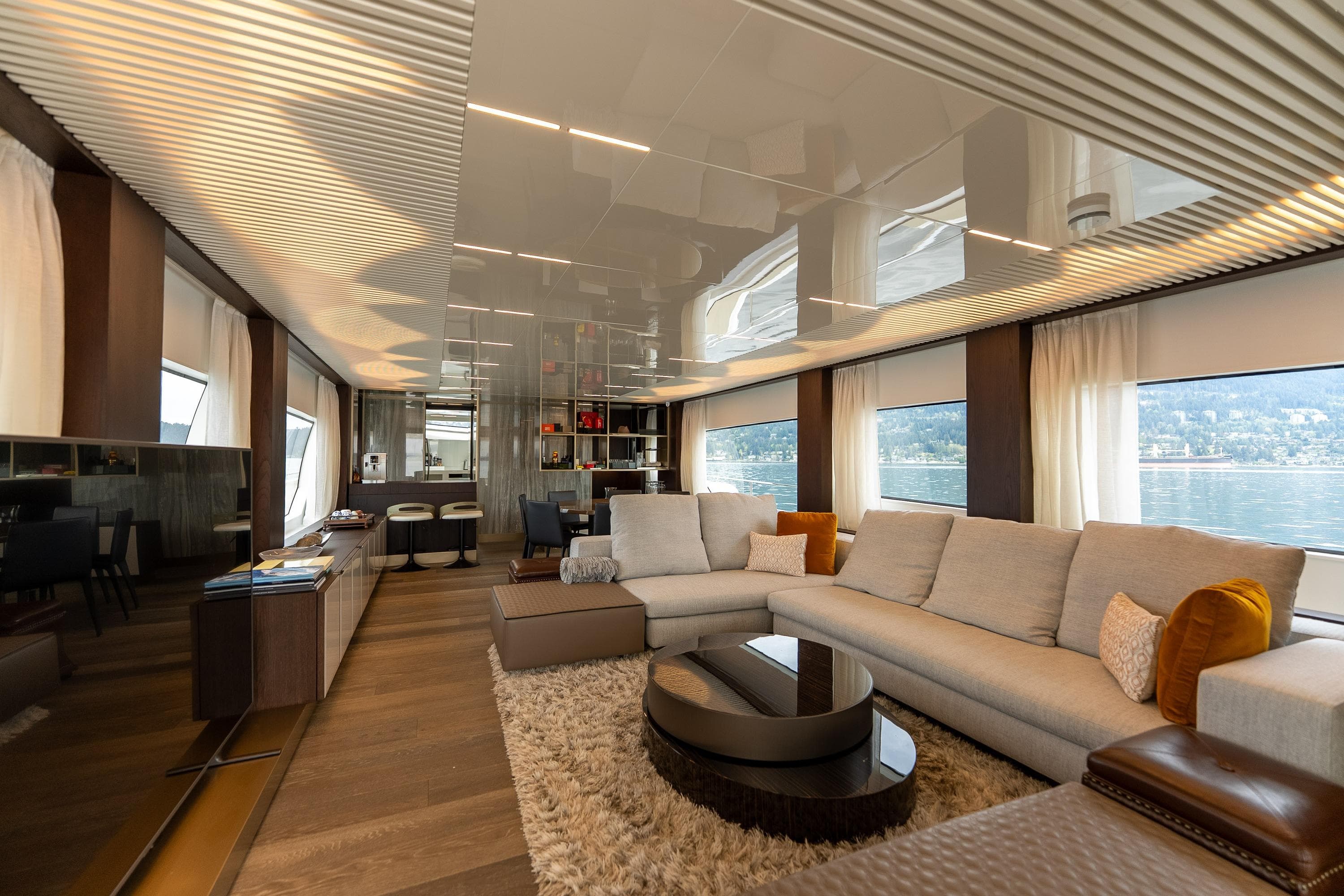 Luxurious interior of 2020 Ferretti Yachts 850, featuring elegant seating and panoramic windows.