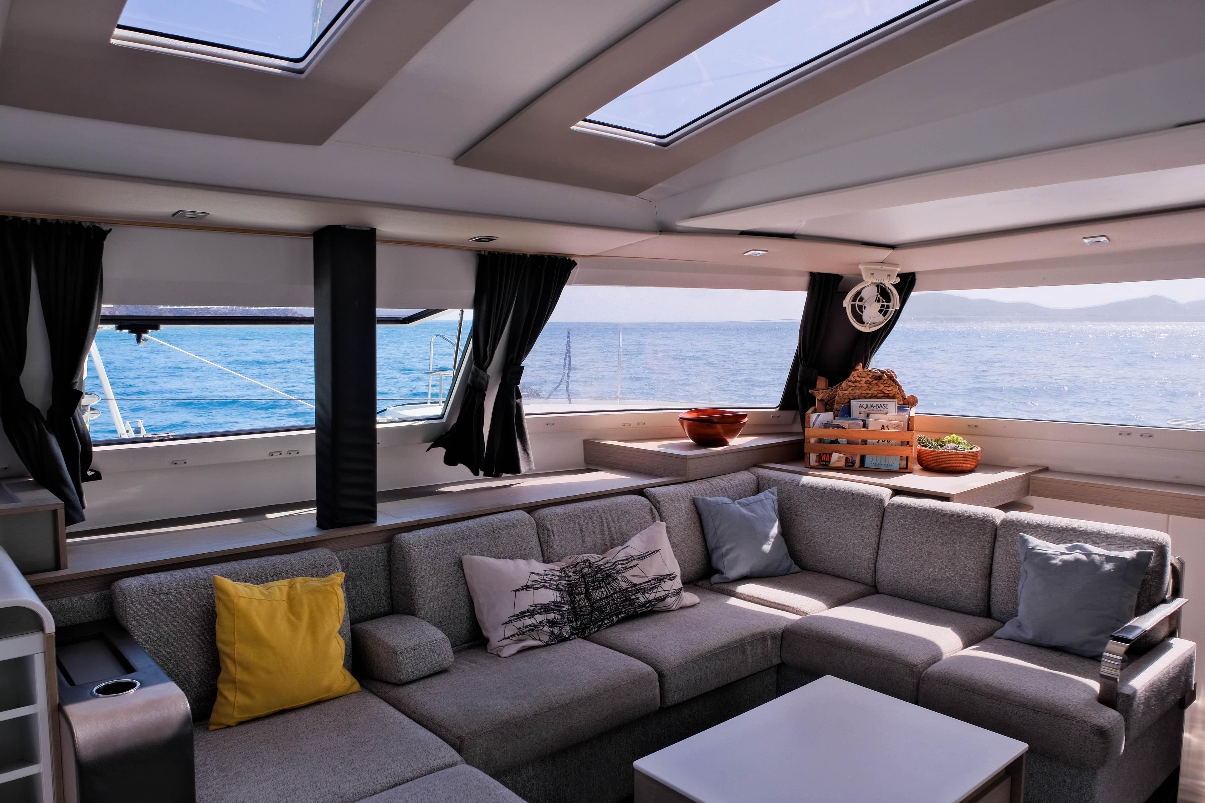 Luxurious interior of 2021 Fountaine Pajot Elba 45 Catamaran with ocean view.
