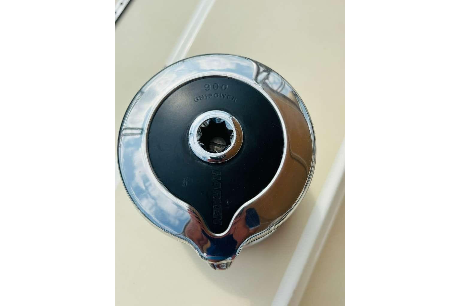 Chrome winch handle on a 1982 Steven Custom Stevens 47 yacht, marked "900 Unipower."