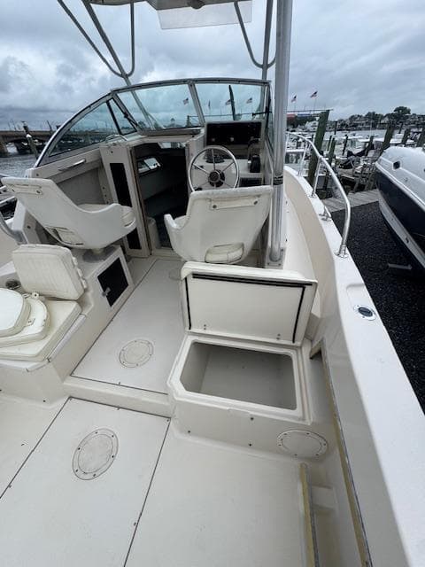 1992 Grady-White Explorer 244 boat interior with steering wheel and seating.