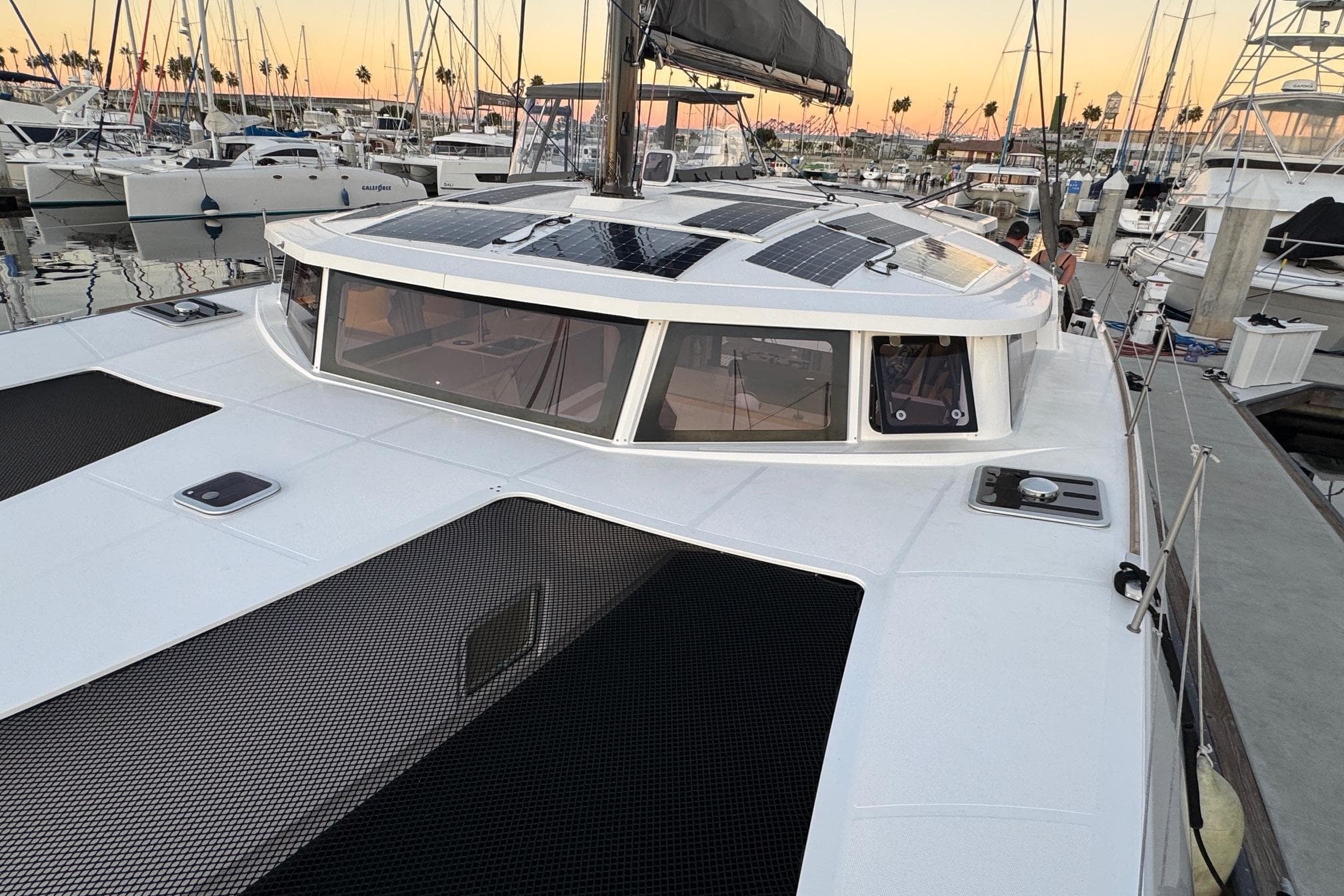 2023 NEEL 43 trimaran docked at marina with solar panels on deck.