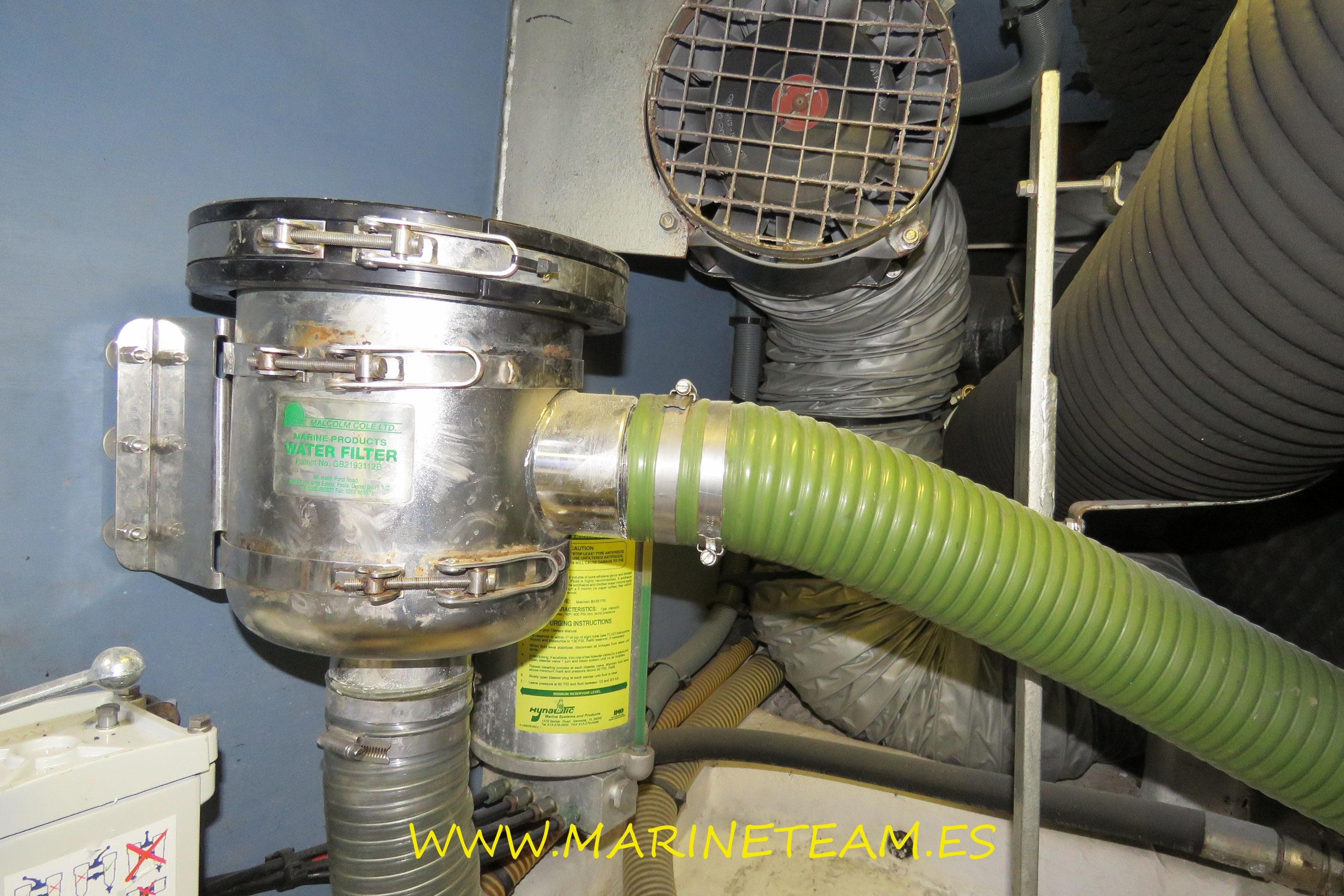 Engine room of a 1995 Princess 60 yacht with water filter and ventilation system.