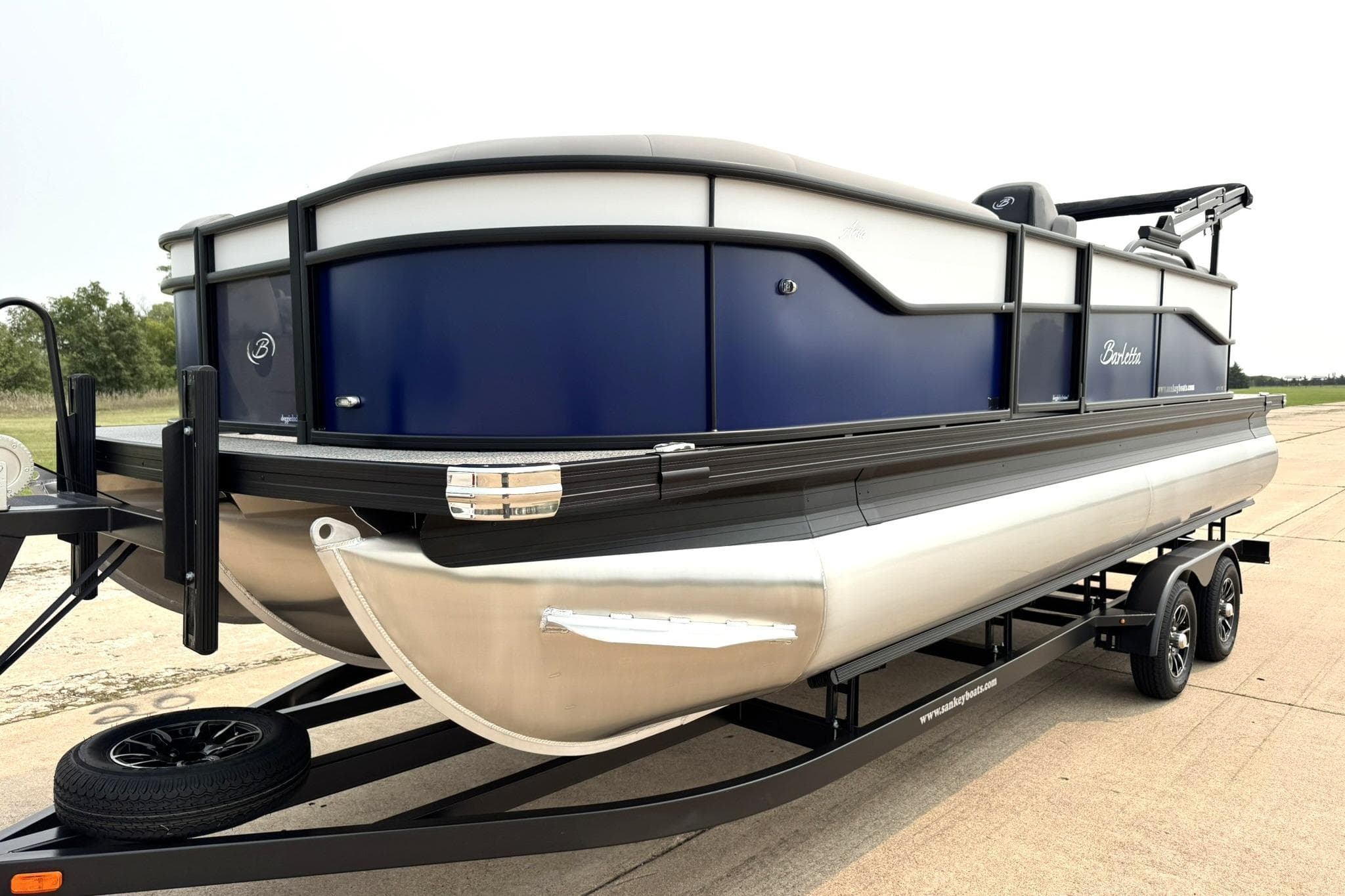 2026 Barletta ARIA 22QC pontoon boat on trailer, featuring sleek design and modern build.