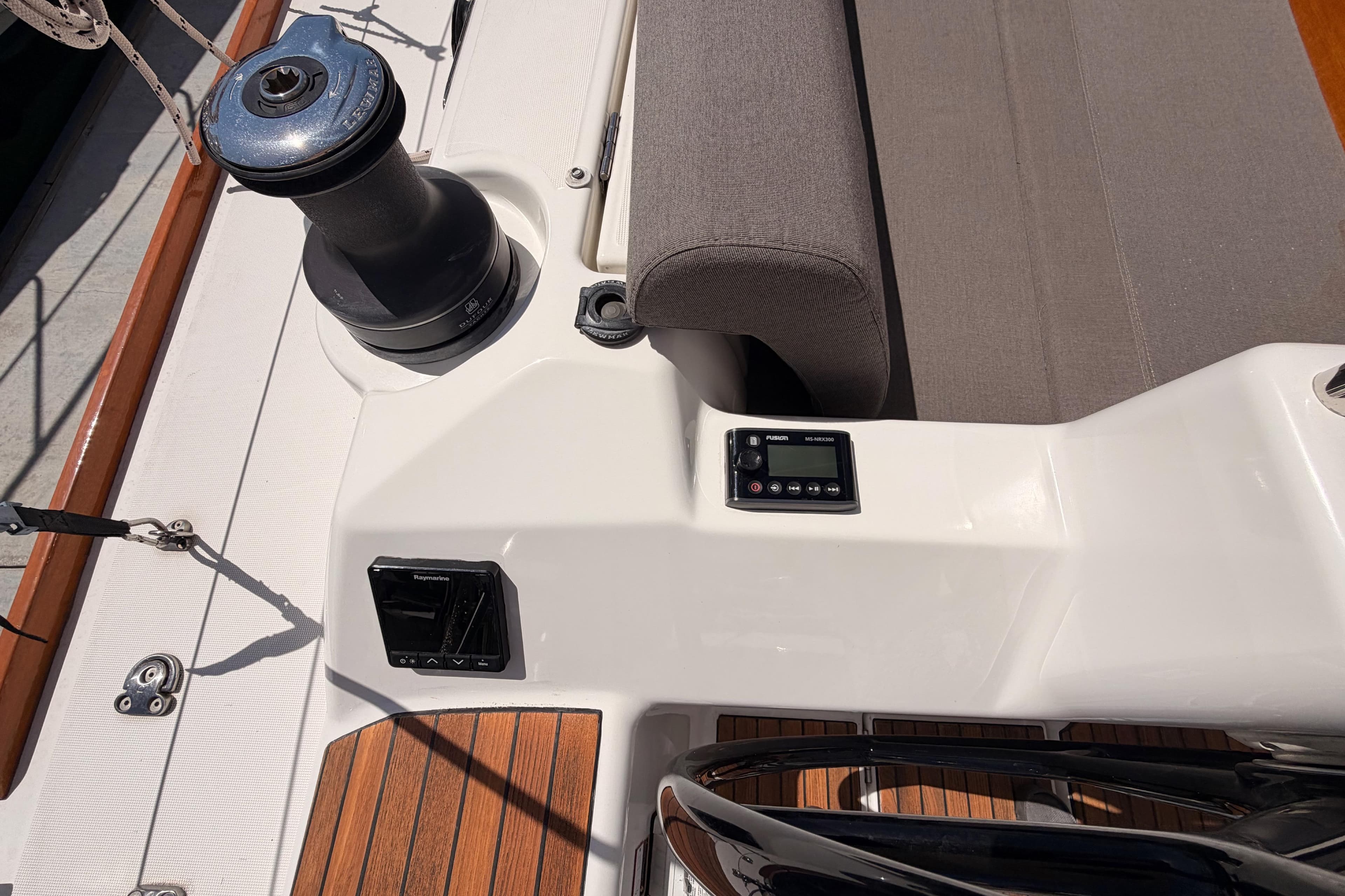 Cockpit of 2019 Dufour 460 Grand Large yacht with winch and control panel.