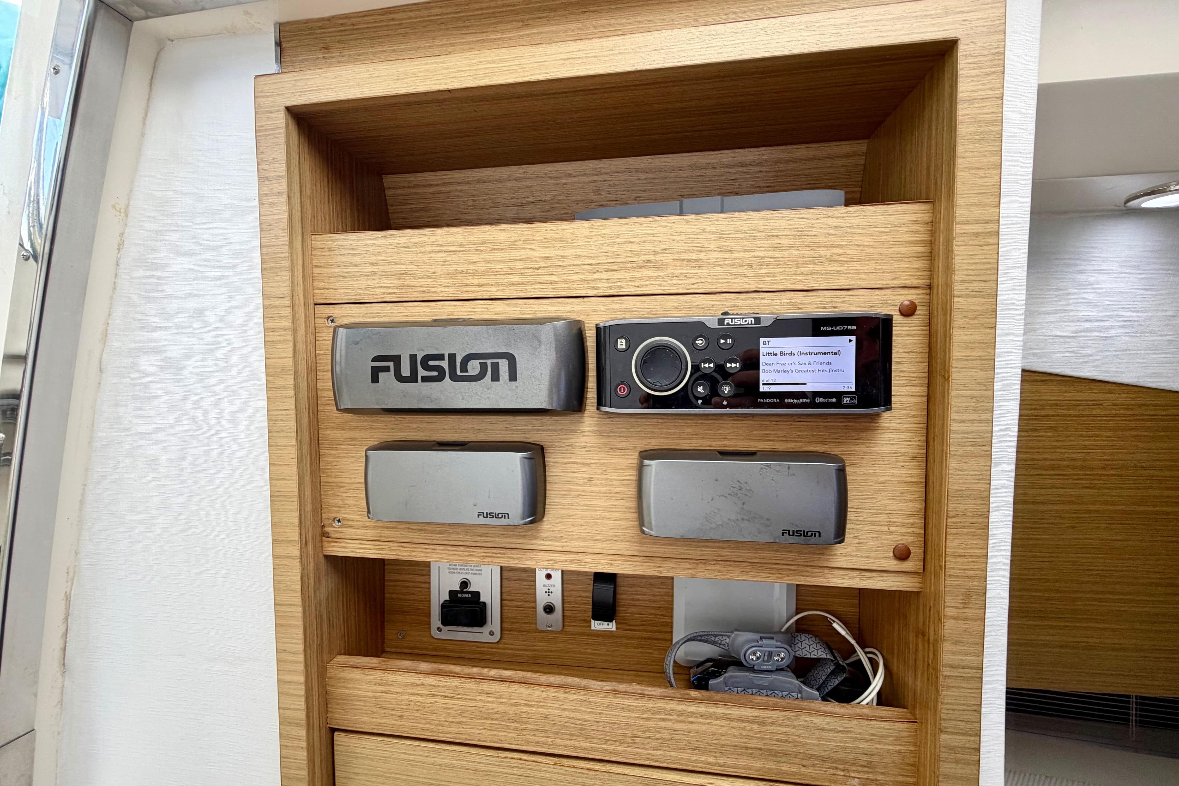 Fusion stereo system on 2014 Azimut Verve 40 yacht, featuring wooden paneling.