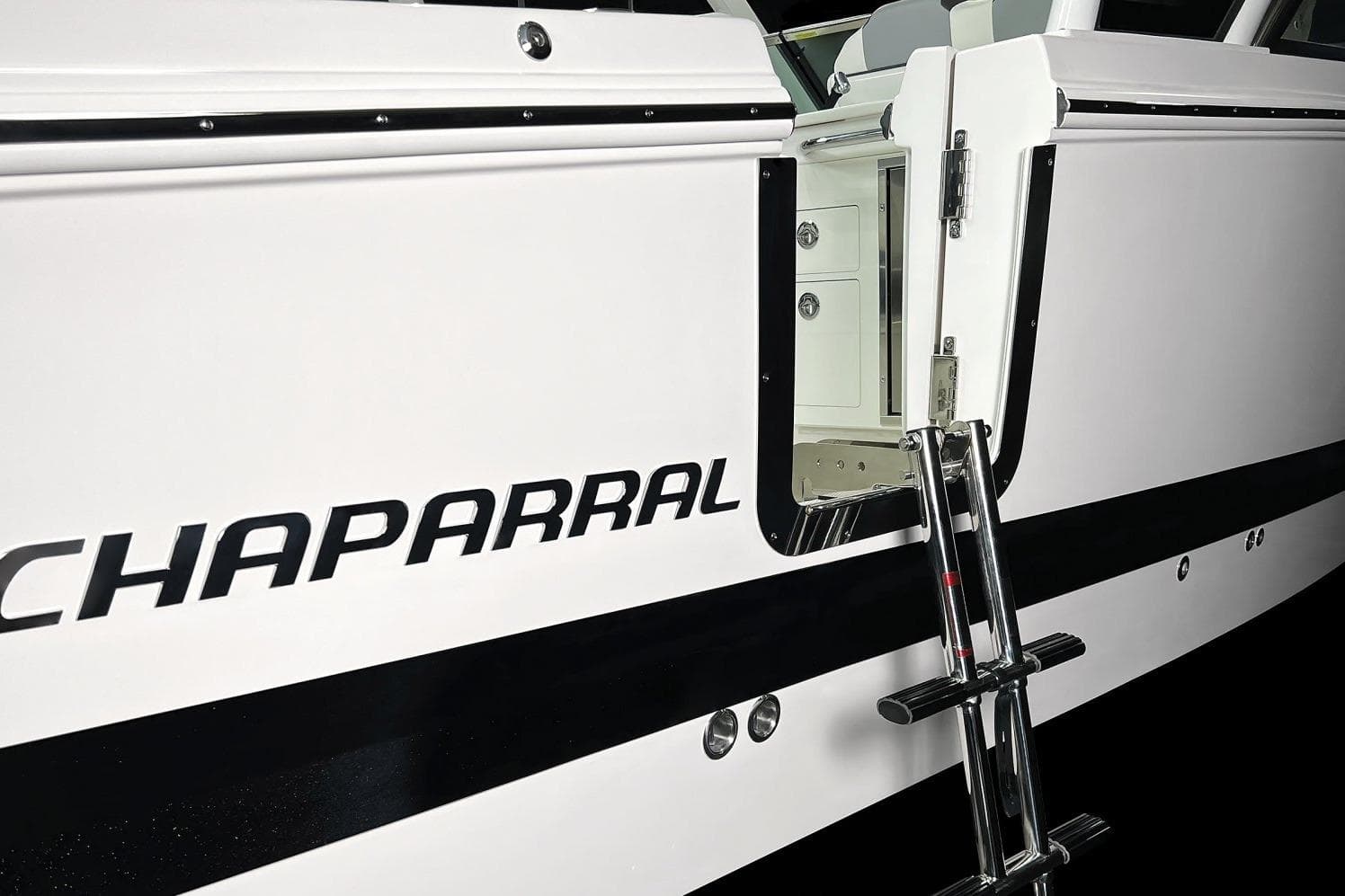2026 Chaparral 310 OSX boat with open side door and ladder.