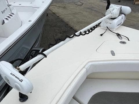 2021 BlackJack 256 Coastal Bay boat with Minn Kota trolling motor on deck.