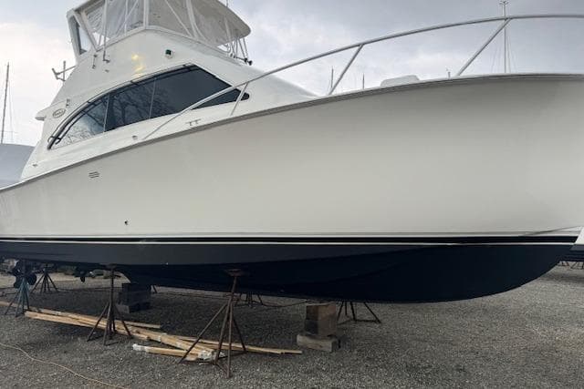 1998 Ocean Yachts 40 Super Sport boat on stands, side view.