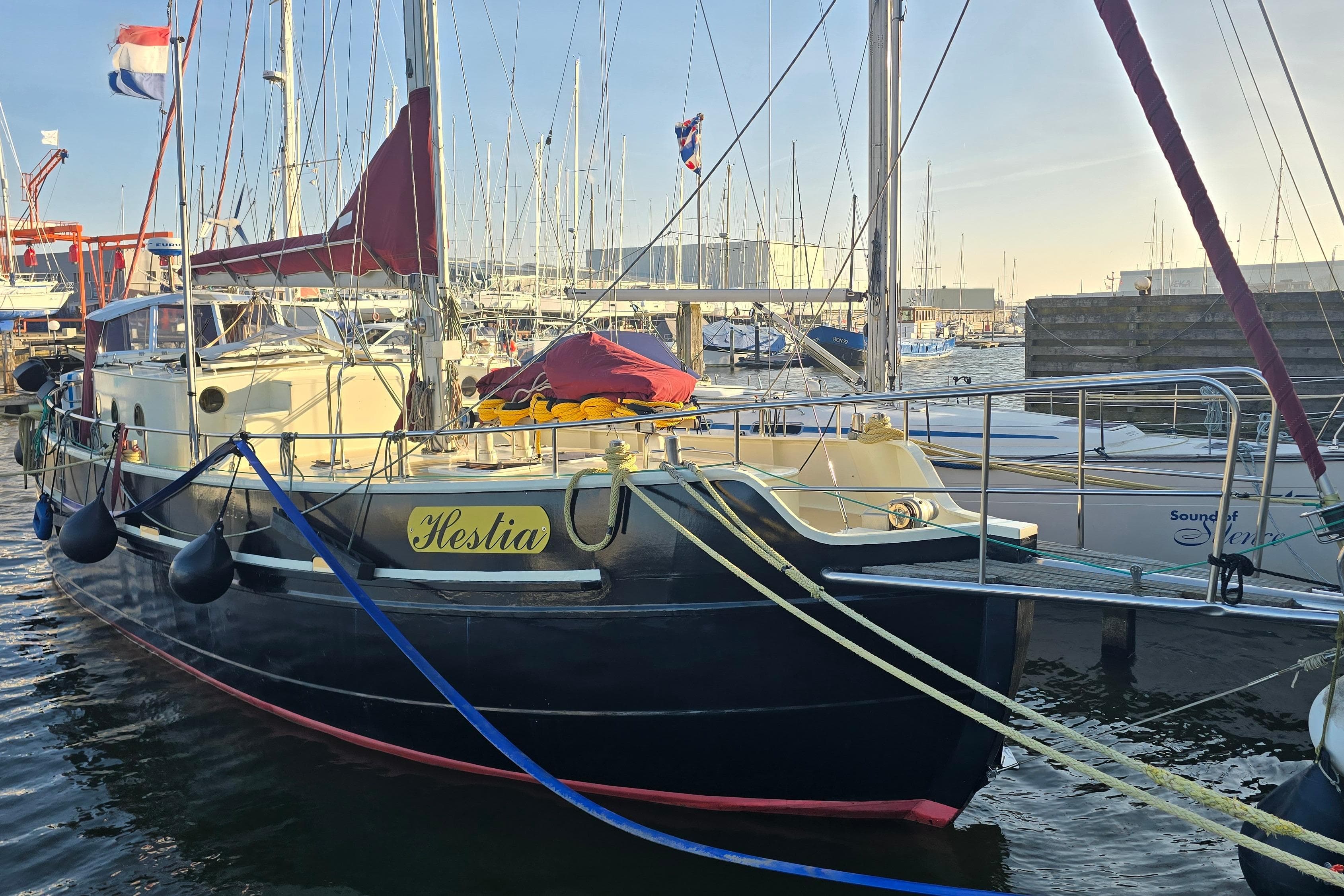 Colin Archer Bronsveen 14.70 yacht, 2002 model, docked in a marina.