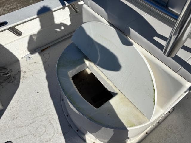 2022 May-Craft 22 Hancock Skiff boat interior with open storage compartment.