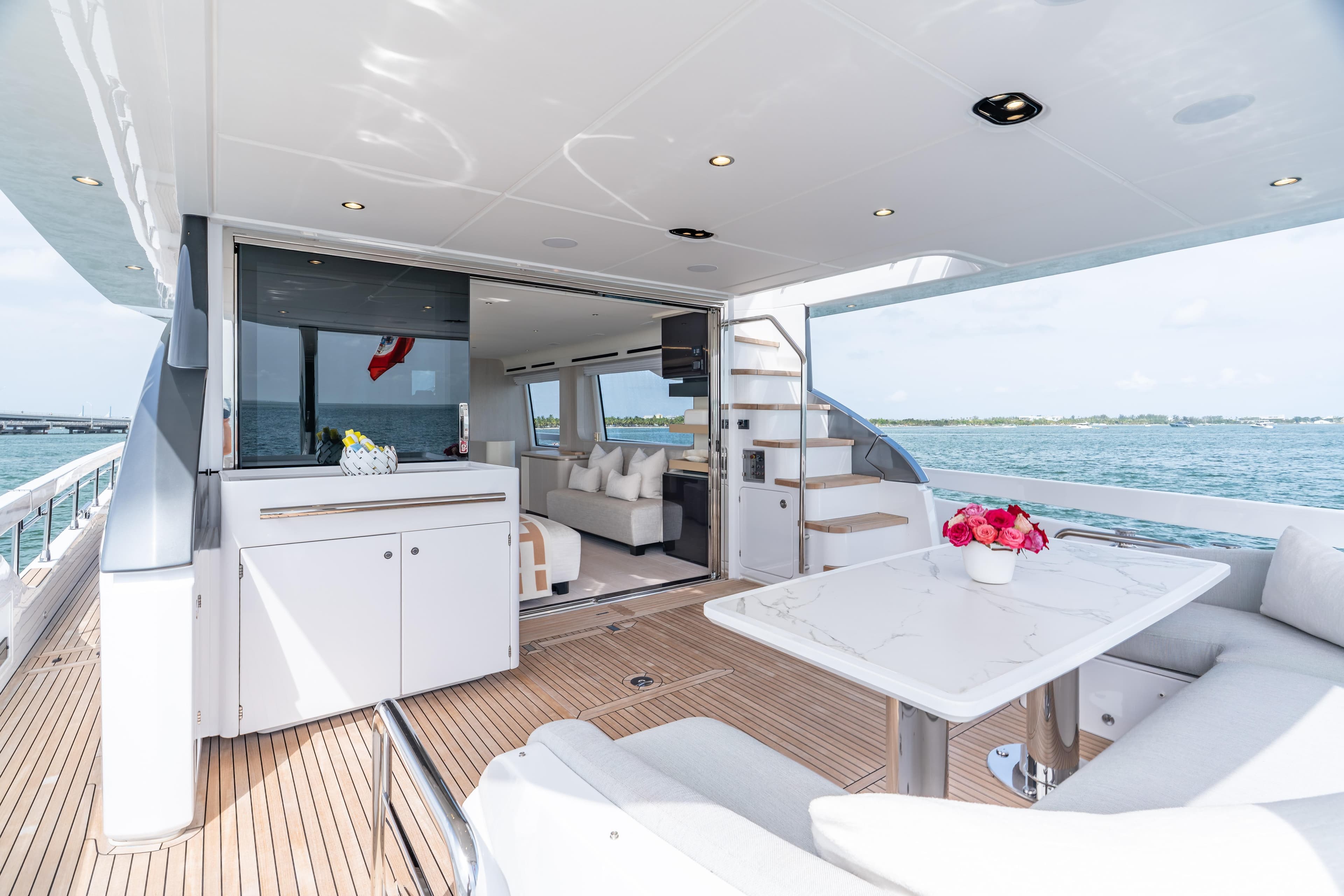 Luxurious 2022 Azimut 78 yacht interior with elegant seating and ocean view.
