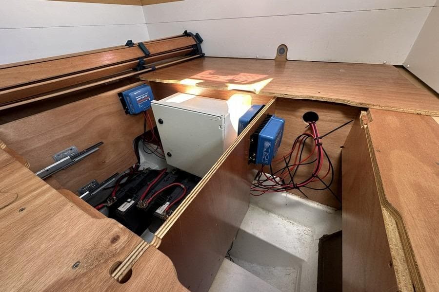 Electrical compartment of a 2013 Lagoon 39 catamaran with batteries and wiring.