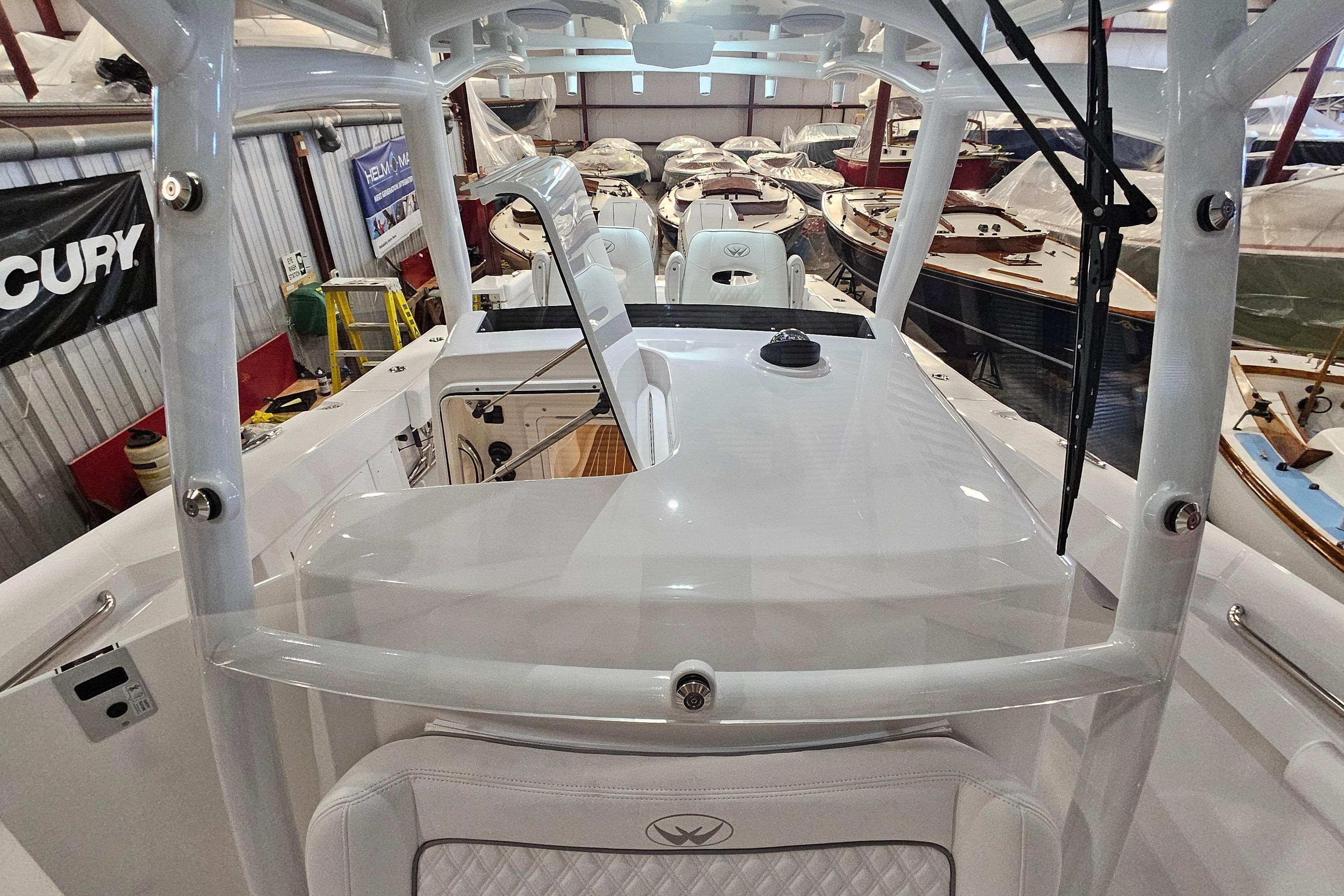 2026 Southport 30 FE boat interior in a showroom with other boats.